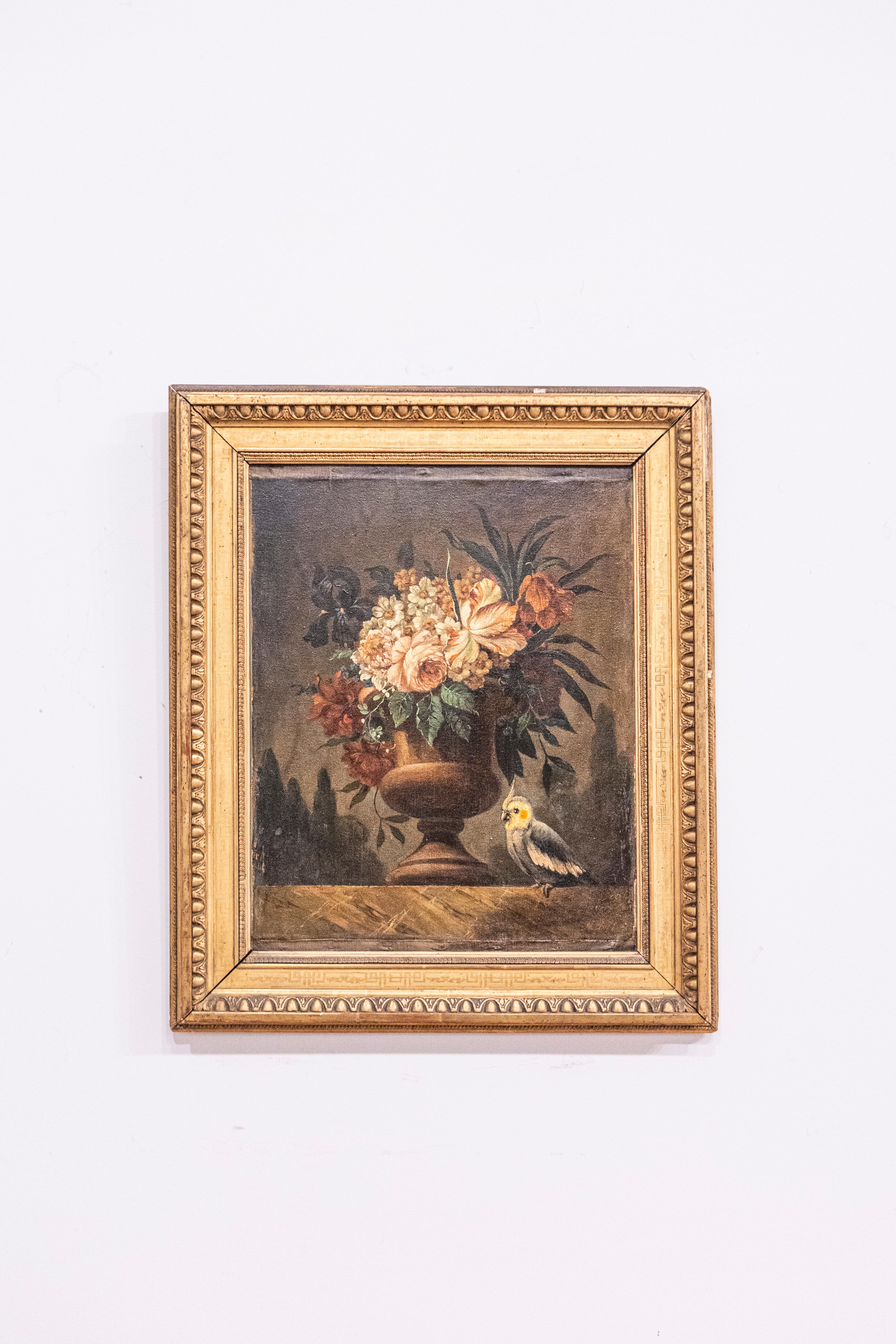 A French framed oil on canvas still-life painting from the 18th century, depicting a bouquet of flowers and a parakeet. Born in France during the Age of Enlightenment, this lovely oil painting of vertical format features a luscious bouquet of pink,
