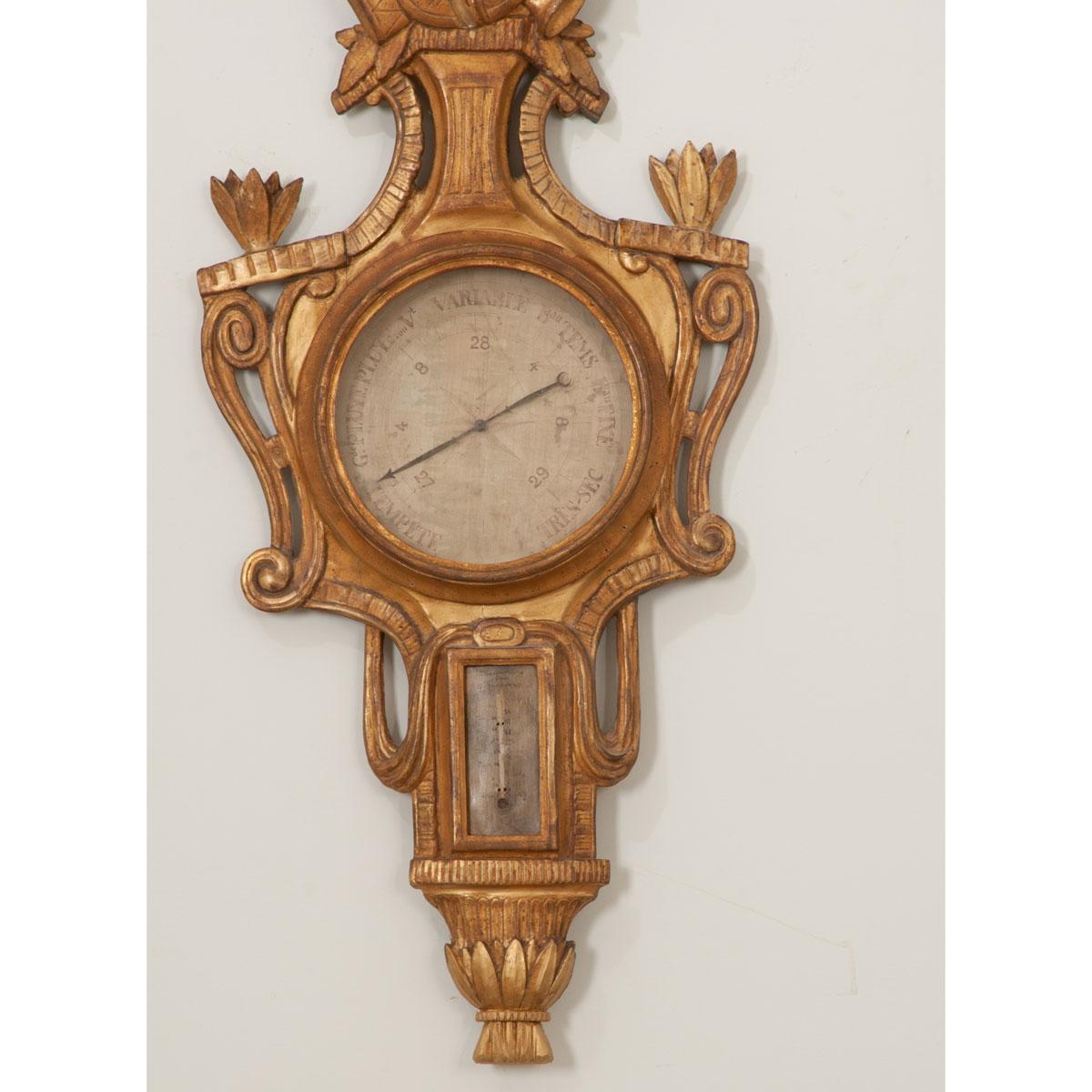 A stunning gold gilt Louis XVI barometer, made in France circa 1780. The instrument was used to measure atmospheric pressure and had a thermometer below the central dial to measure air temperature. Although this barometer has lost its scientific
