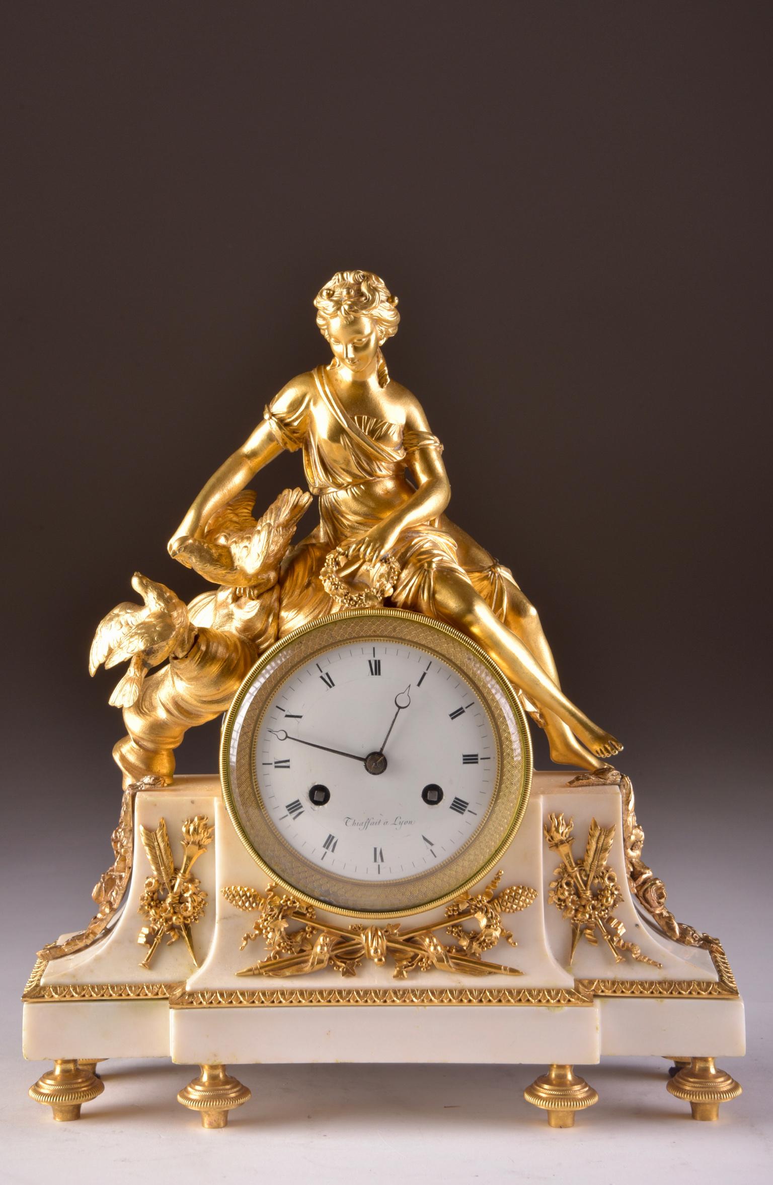 Magnificent and refined clock, late 18th century, movement from
Chiaffait a Lyon.
Structure in finely chased and gilded bronze figuring the allegory of Psyche and birds. It rest on a white Carrara marble base.
The clock has its beautiful original