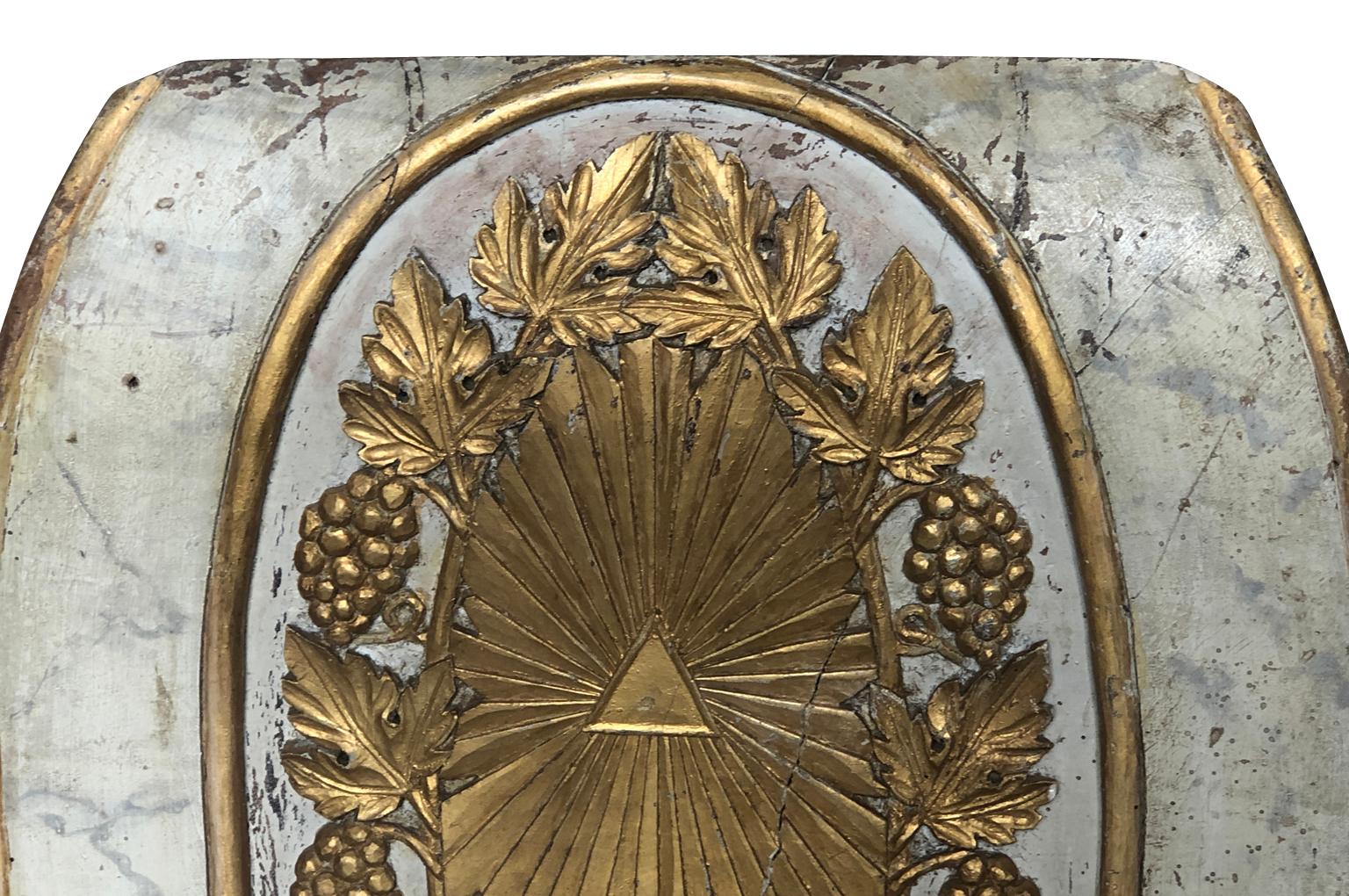 A very beautiful French 18th century boiserie fragment beautifully carved from polychromed and giltwood. A wonderful motif of the Holy Trinity surrounded by a sunburst.