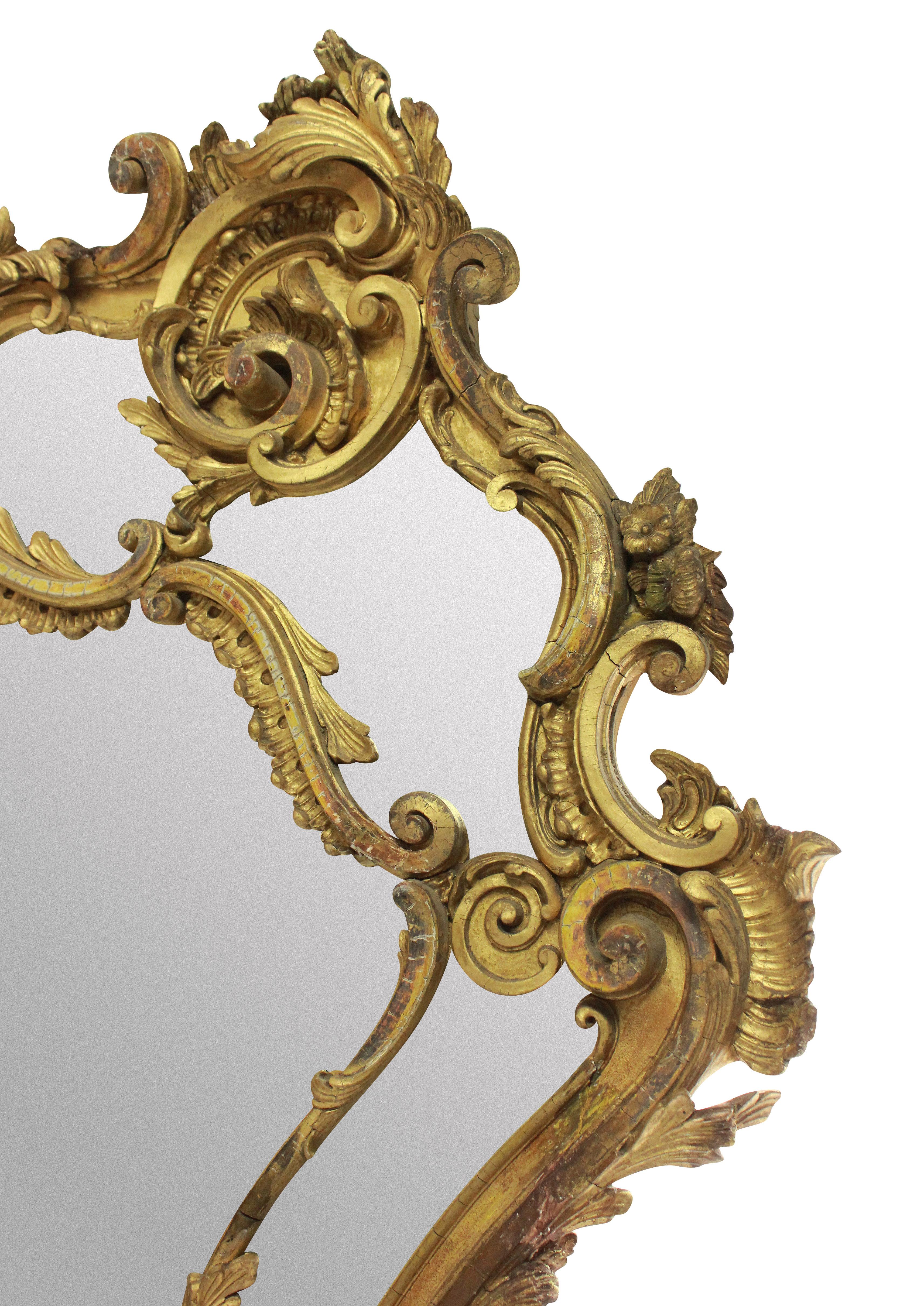 A French, late 18th century giltwood mirror in the Rococo manner.