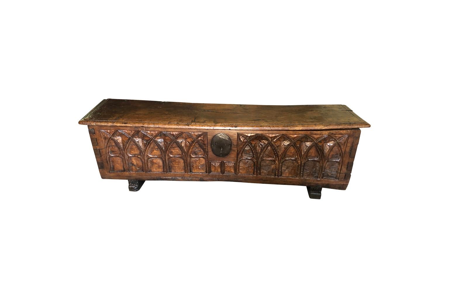 A very handsome French 18th century Gothic style coffer, trunk beautifully constructed from solid boards of richly stained oak. Wonderful carving detail. Super patina. Terrific at the foot of a bed, under a picture window, or as a narrow coffee