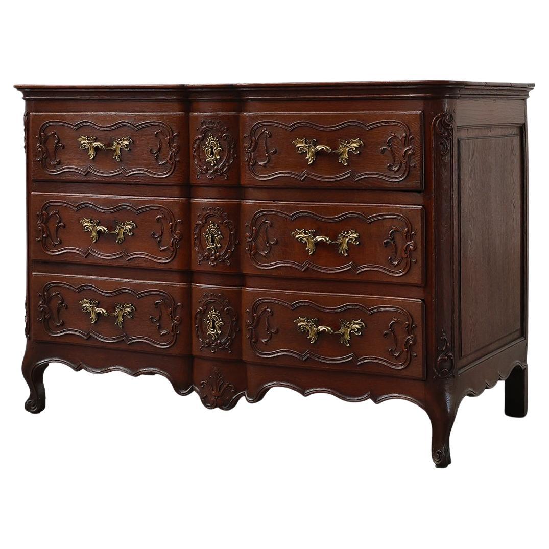 French 18th Century hand crafted oak chest of drawers in Louis XV style