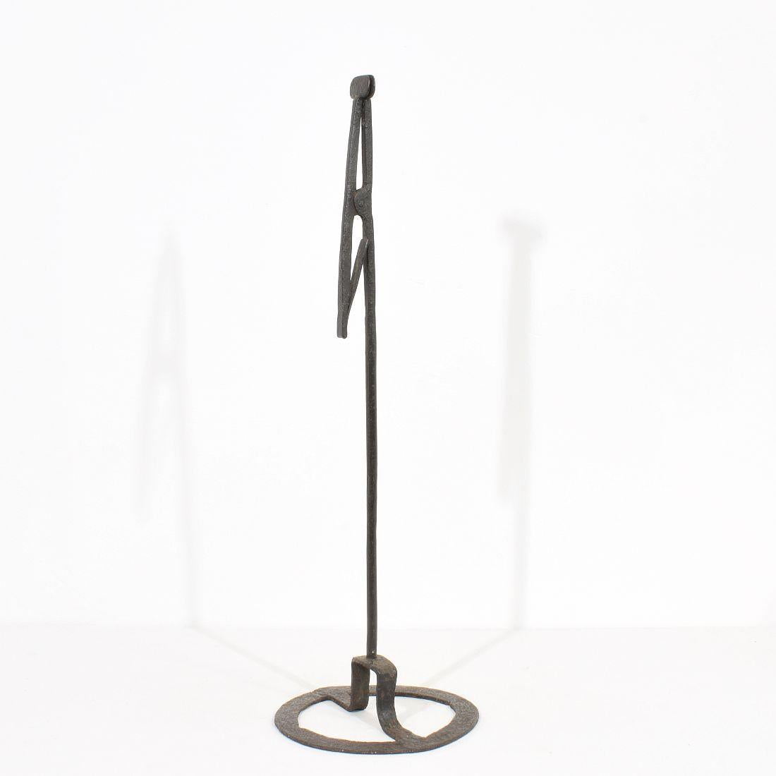 Very old and beautiful hand forged iron candleholder.
France, circa 1700-1750. Weathered.
