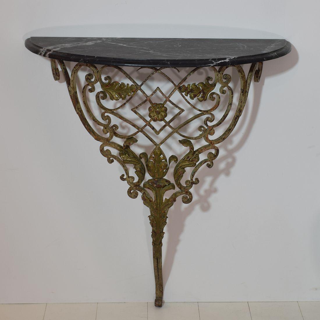 Beautiful hand forged iron marble-top console table.
A unique and original period piece with marble top of a later date
France, circa 1750-1800. Weathered and small losses.
  