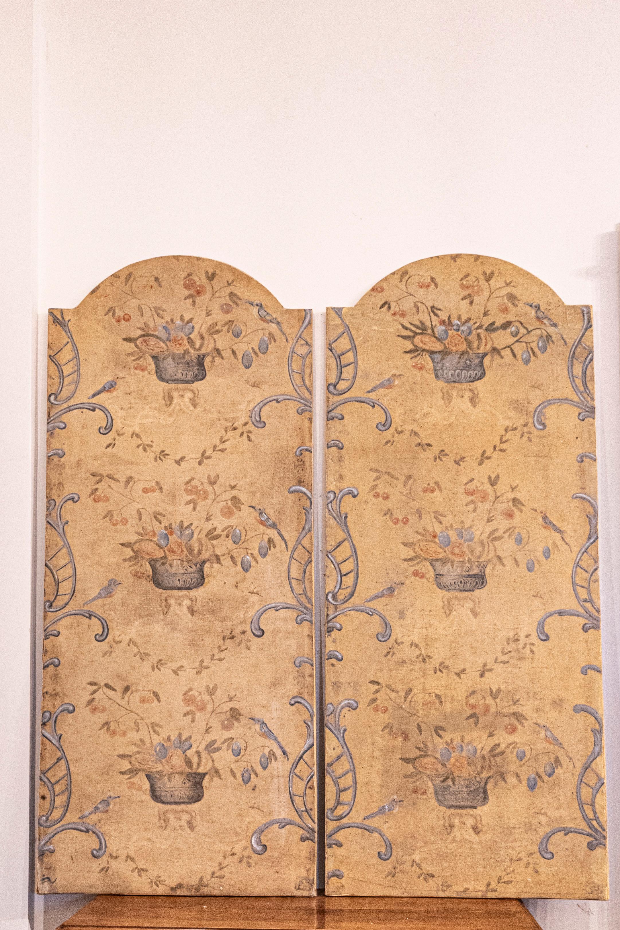 A pair of French 18th century hand-painted decorative panels with silver vases birds in foliage. This enchanting pair of French 18th-century hand-painted decorative panels captures the essence of nature's tranquility and the era's artistic elegance.