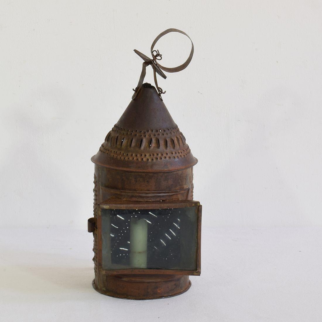 Beautiful and rare iron lantern with a glass window,
France, 18th century. Weathered.



 