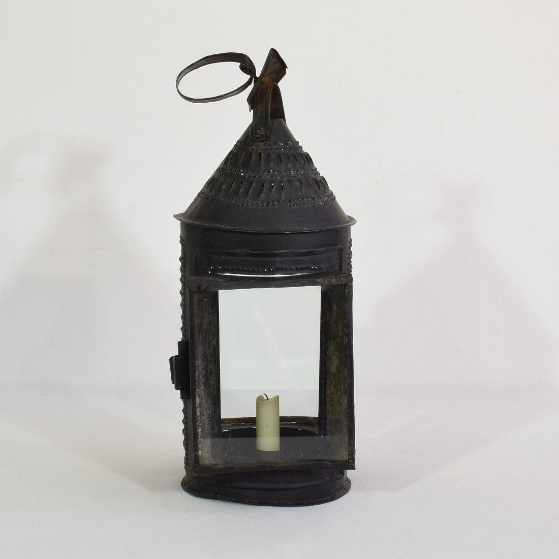 Beautiful and rare iron lantern with two glass windows,
France, 18th century. Weathered.



  