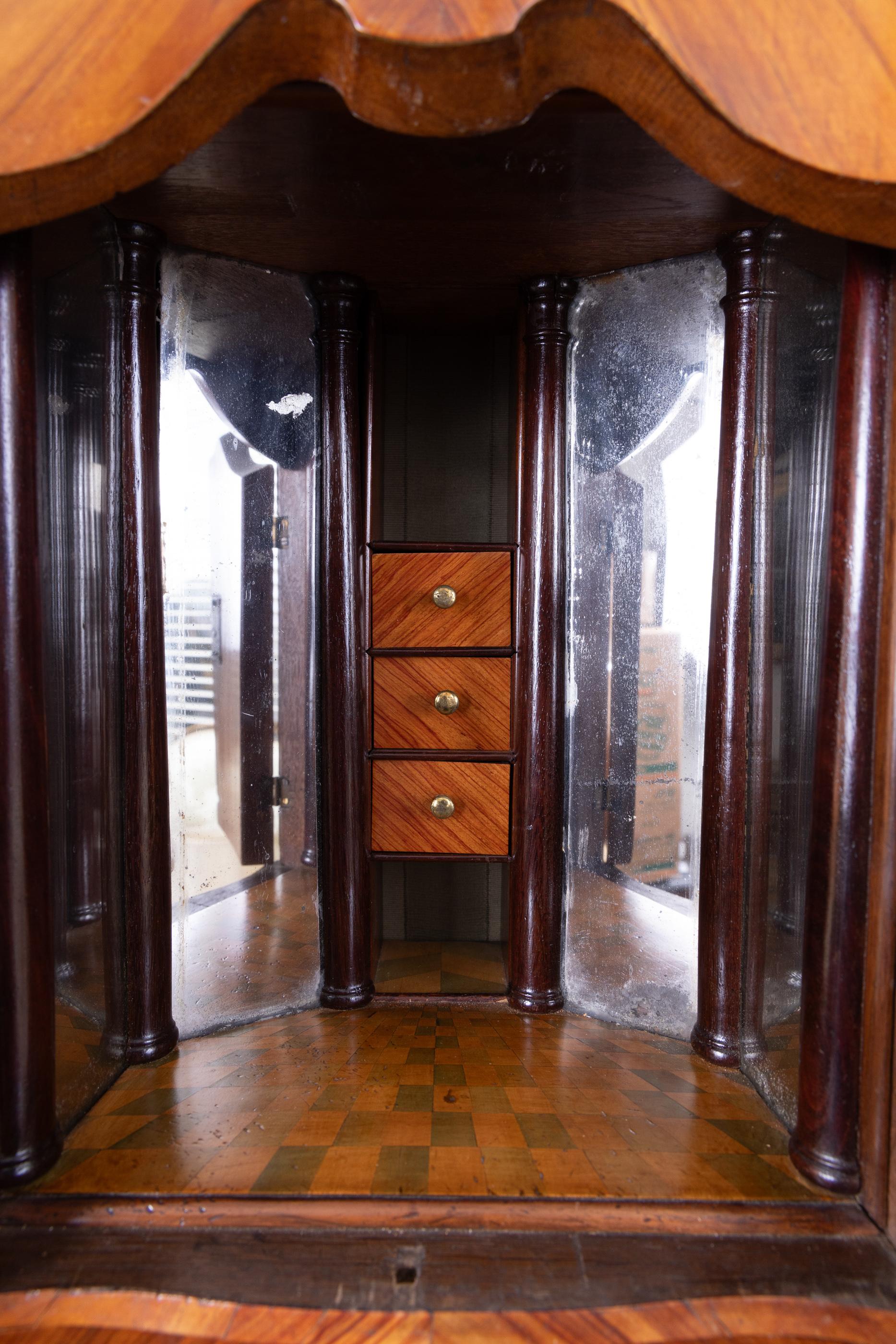 French 18th century Louis XV Bombe` heavily veneered secretaire, with glass doors at top, and secret door with checkerboard floor in small compartment, with mirrored walls to give the illusion of being larger, and deeper. The secretaire has a Bombe`
