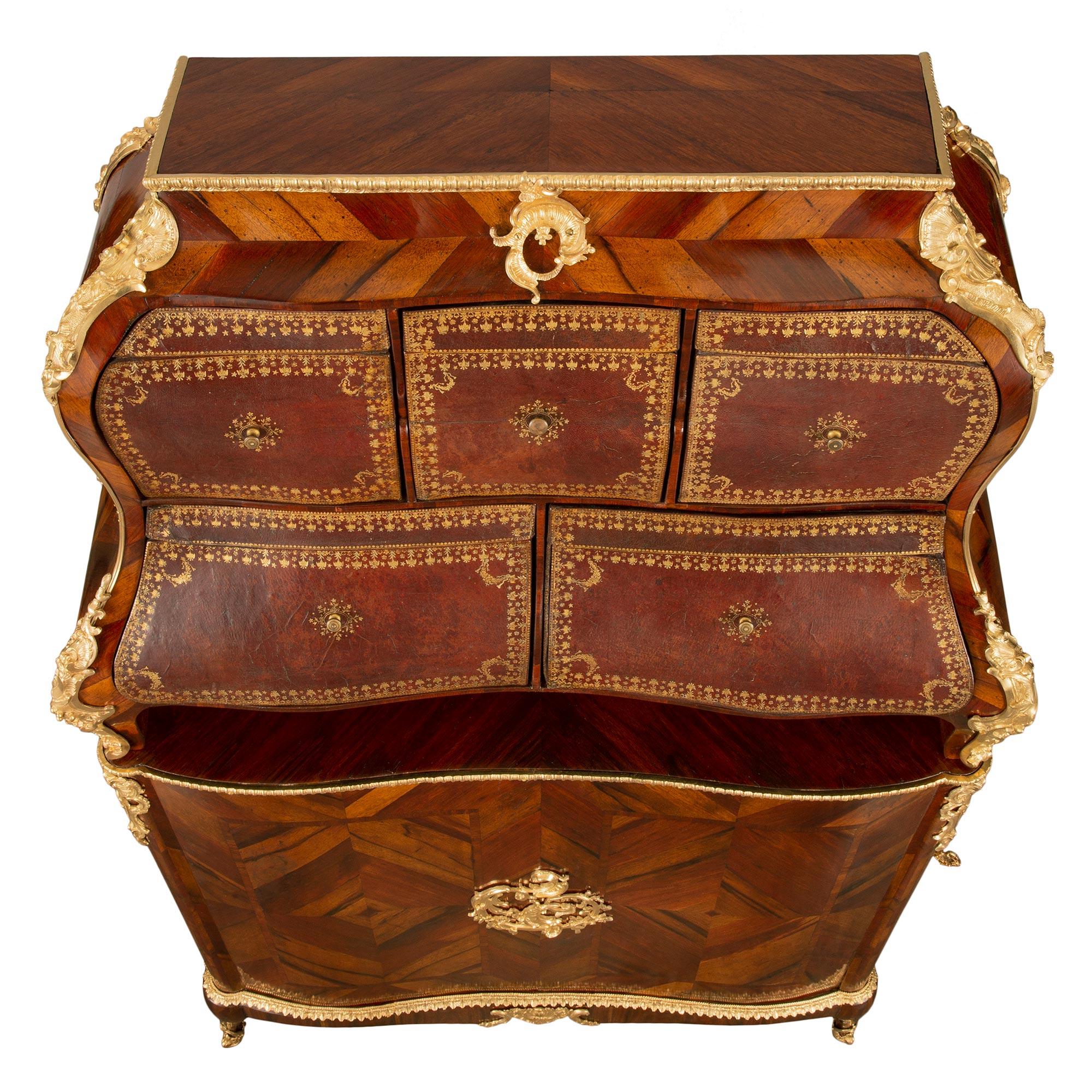 A sensational French 18th century Louis XV Period kingwood, ormolu and leather Cartonnier, signed Jacques DuBois. This most decorative and extremely elegant Cartonnier is raised by handsome lightly curved legs with fine pierced foliate sabots. The