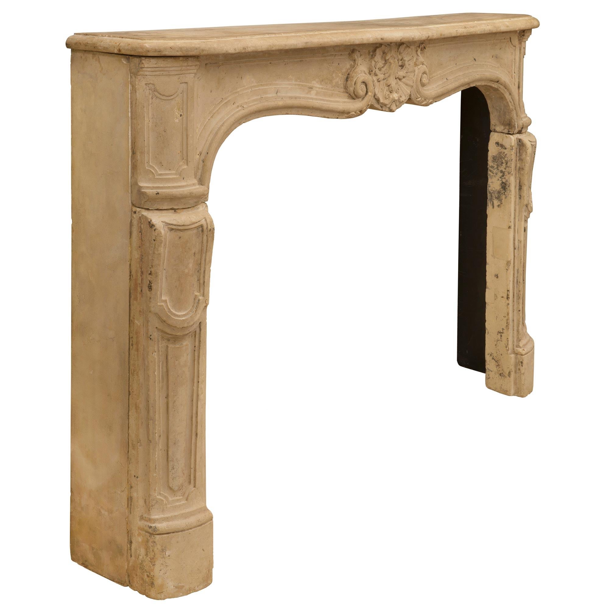 French 18th Century Louis XV Period Limestone Fireplace Mantel In Good Condition For Sale In West Palm Beach, FL