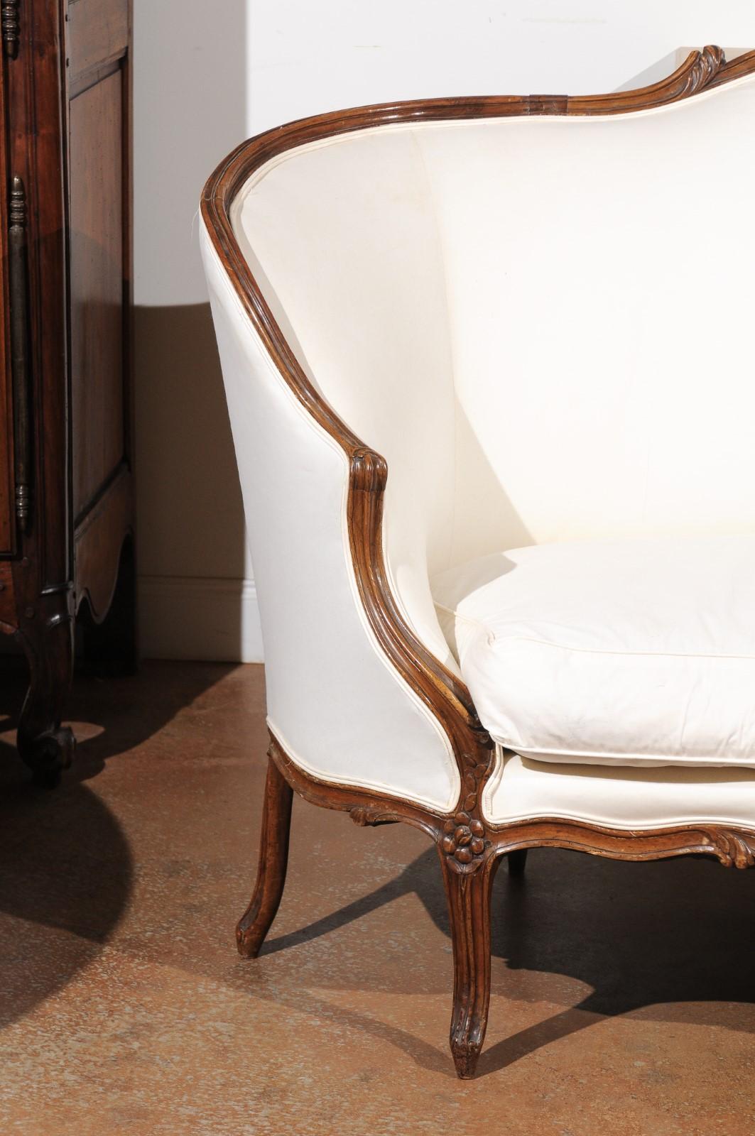 Carved French 18th Century Louis XV Period Walnut Canapé from Lyon with Wraparound Back