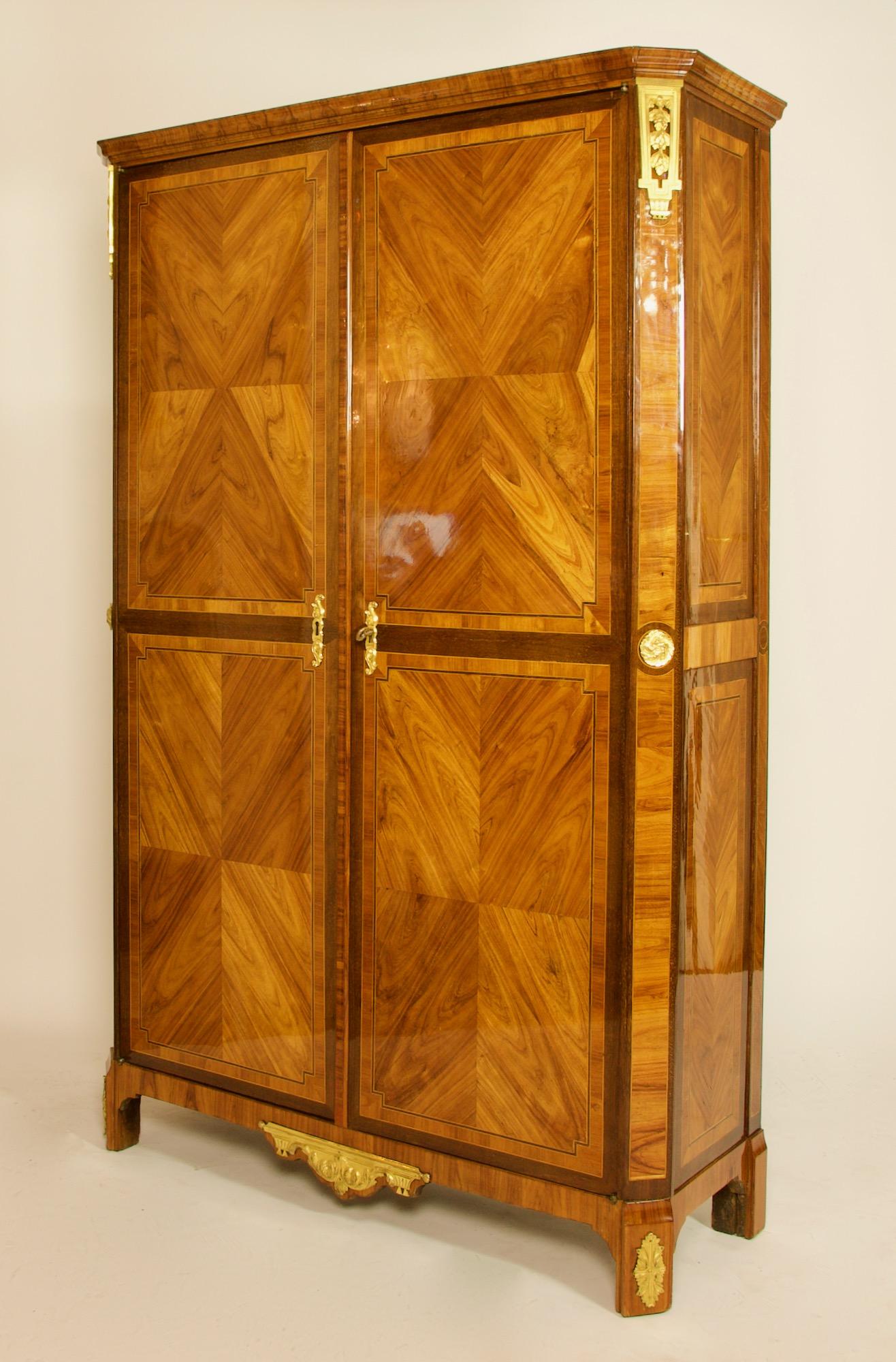 Important French 18th century Louis XVI Marquetry gilt bronze cabinet or armoire stamped by Roger Vandercruse dit Lacroix

An important and excellent Louis XVI cabinet of straight rectangular shape with canted corners standing on four bracket feet