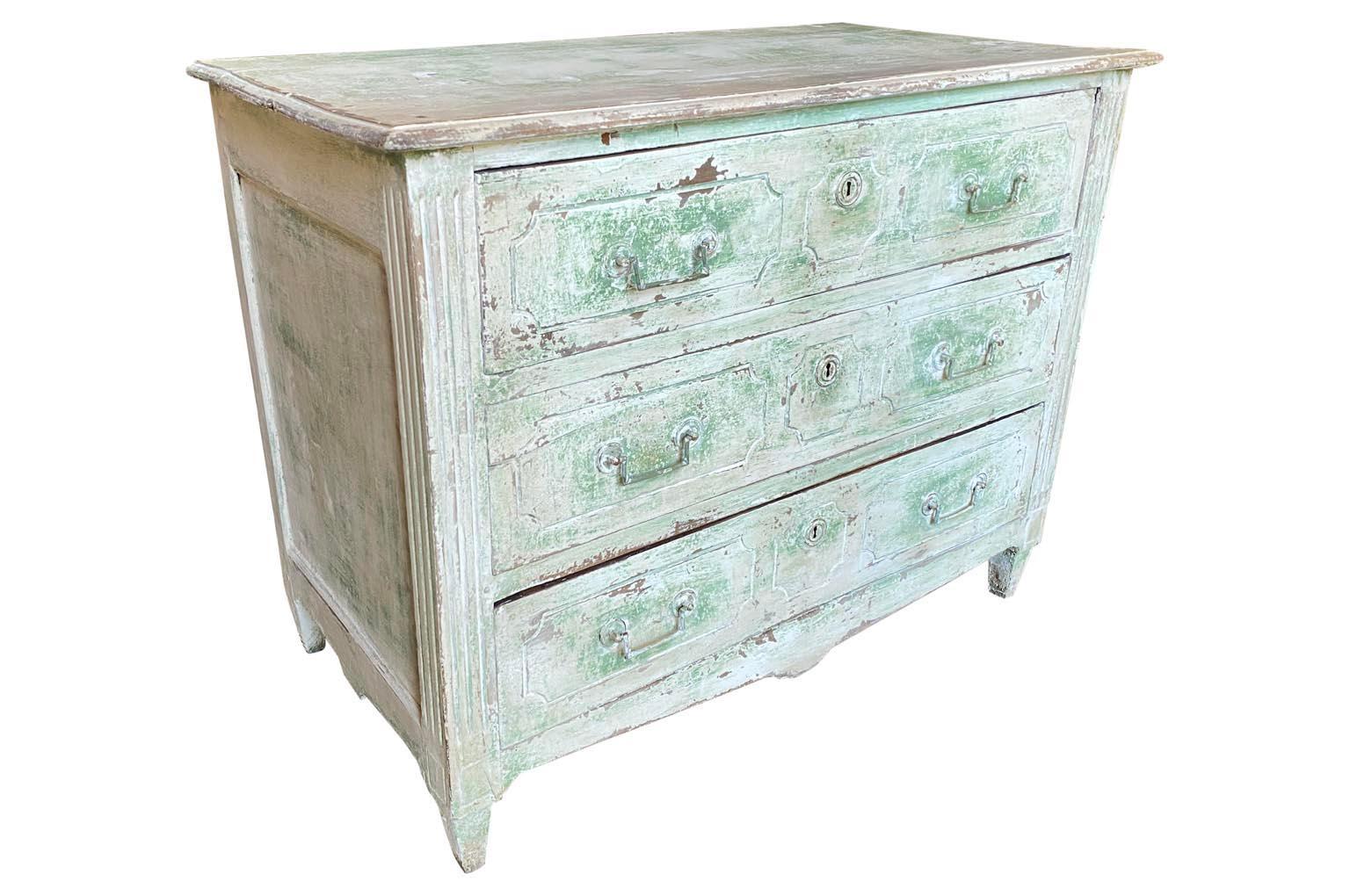 A very lovely 18th century Louis XVI period commode in painted wood with three drawers over tapered feet origining from the South of France. Wonderful painted finish.