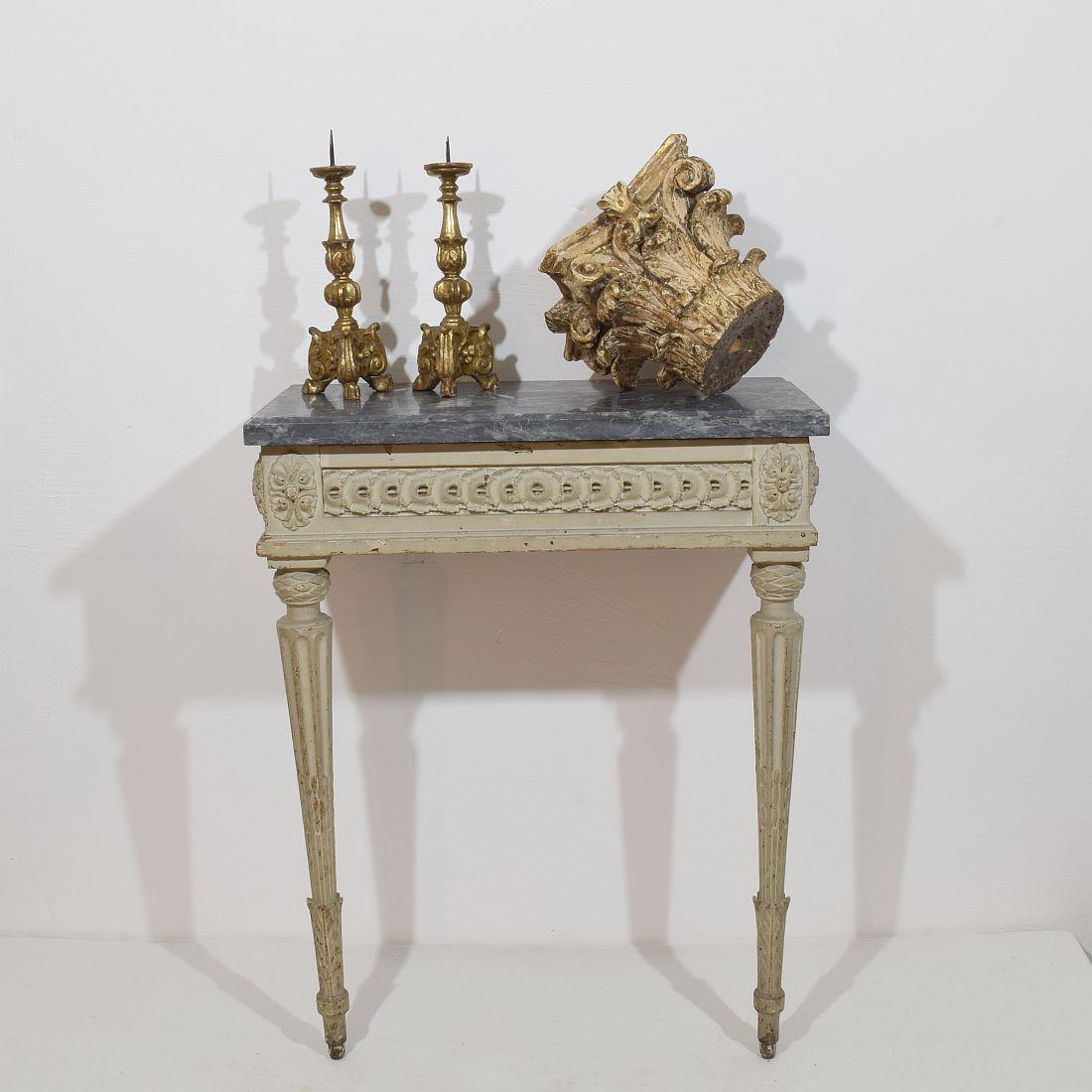 Beautiful marble-top Louis XVI console table. Wonderful carvings and great patina. Original marble top.

France, circa 1770-1889. Weathered and small losses.
More photo's are available on request.
H:76cm  W:62cm D:34,5cm 