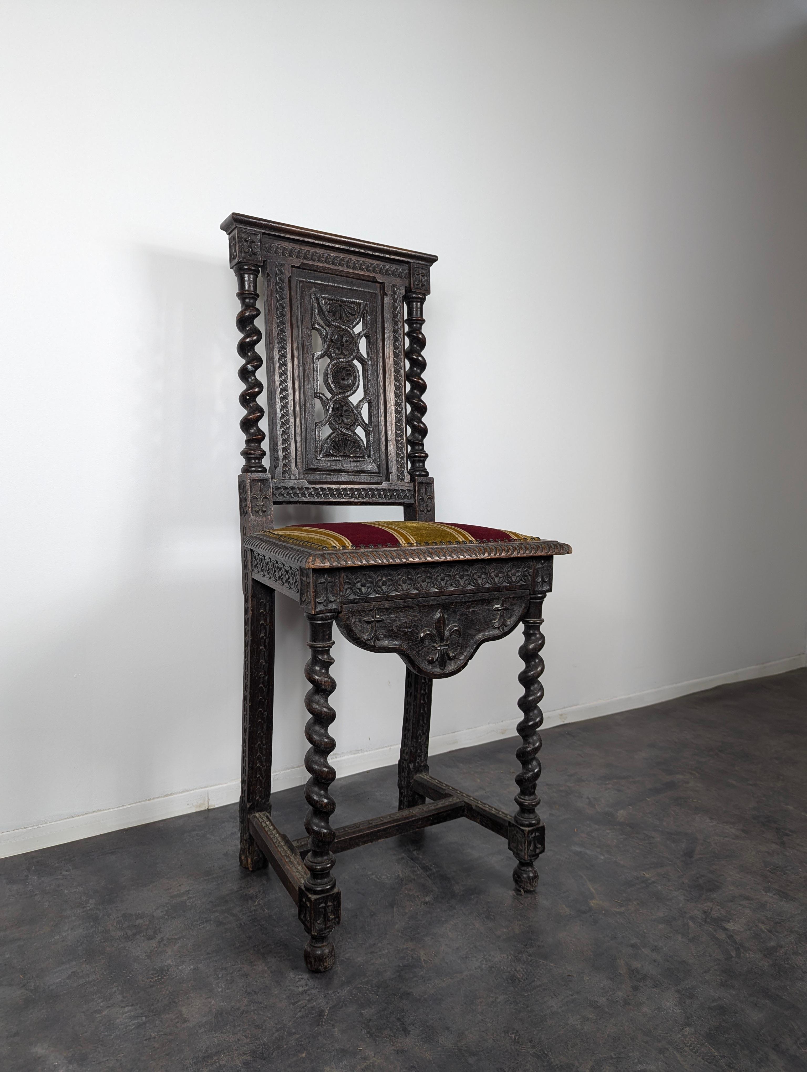 This French 18th-century Louis XIII chair, crafted from solid oak, is a beautiful testament to the enduring elegance of early French design. Characterized by its robust structure and intricate craftsmanship, the chair features turned legs, stretcher