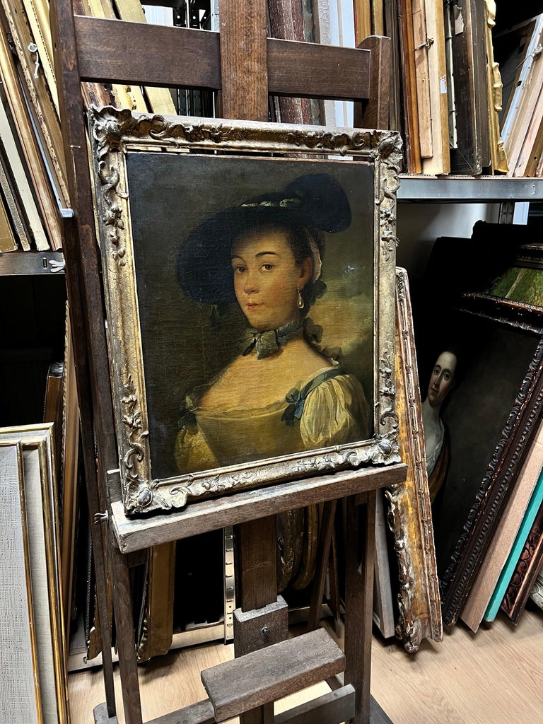 Artist/ School: French School, 18th century (Rococo period)

Title: Portrait of an elegant young beauty from an aristocratic/ noble family, wearing silk and a pearl earring. 

Medium: oil on canvas, framed in period 18th century gilt frame.