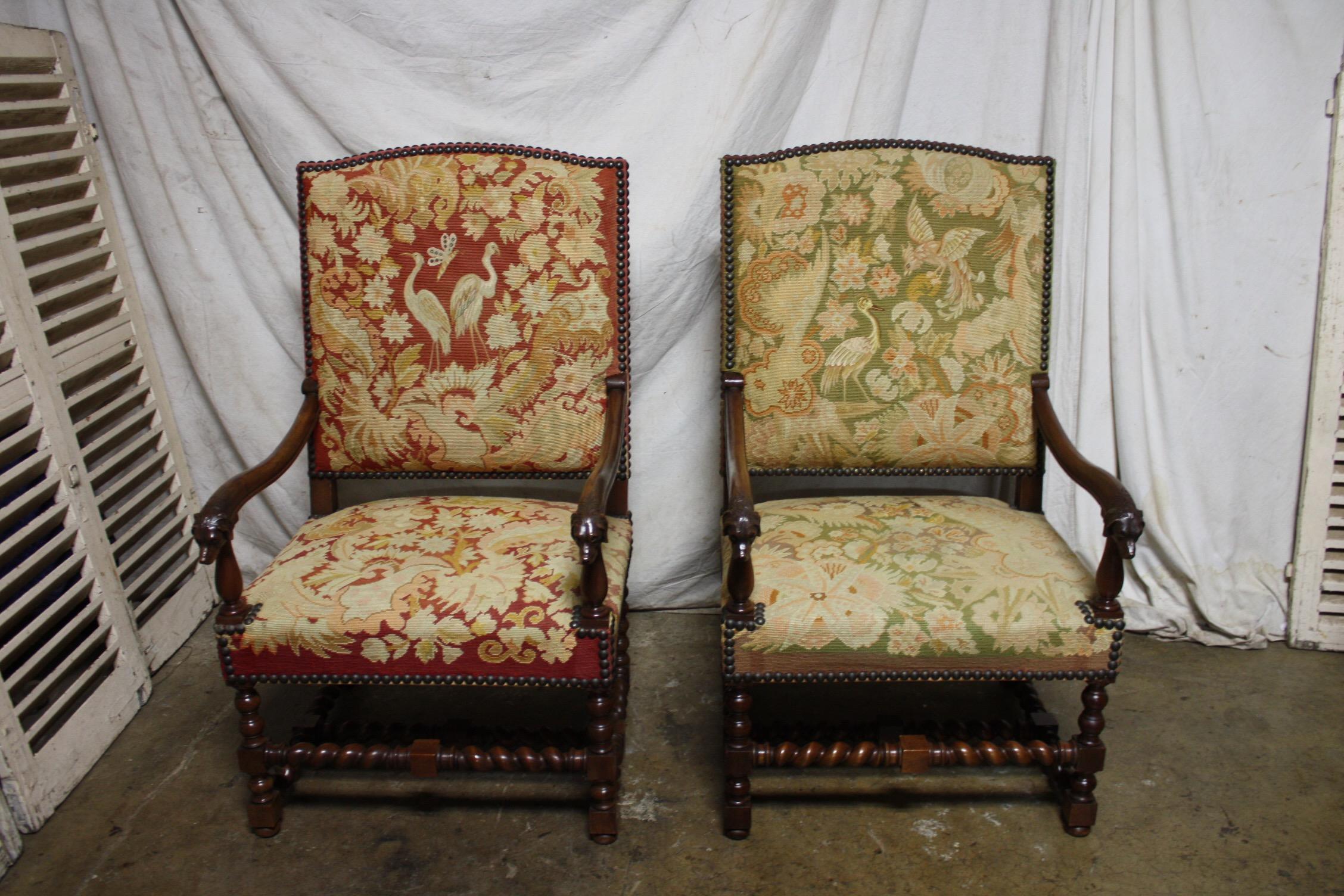 Those armchairs are just amazing by the large size with a beautiful needle point. the end of the arms wears a dog heads. Those kind of chairs were used to be in big properties where they hunting or castle in France.