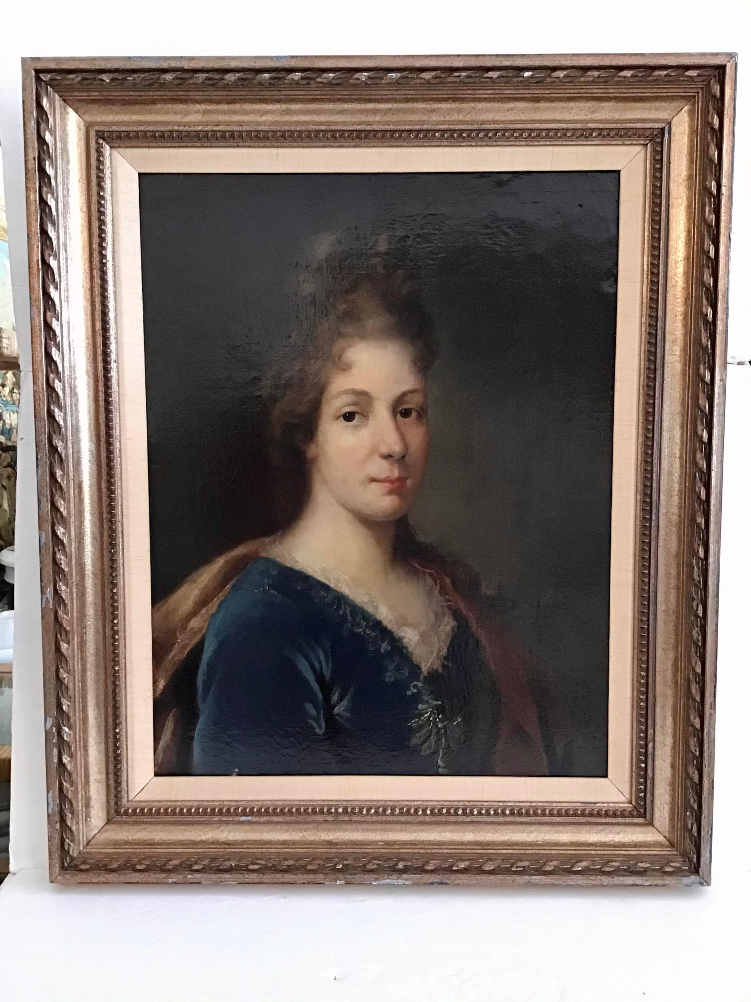 Wonderful 18th century painted portrait of a French noblewoman. The frame is nicely carved and the canvas is in great condition. Classic French style.