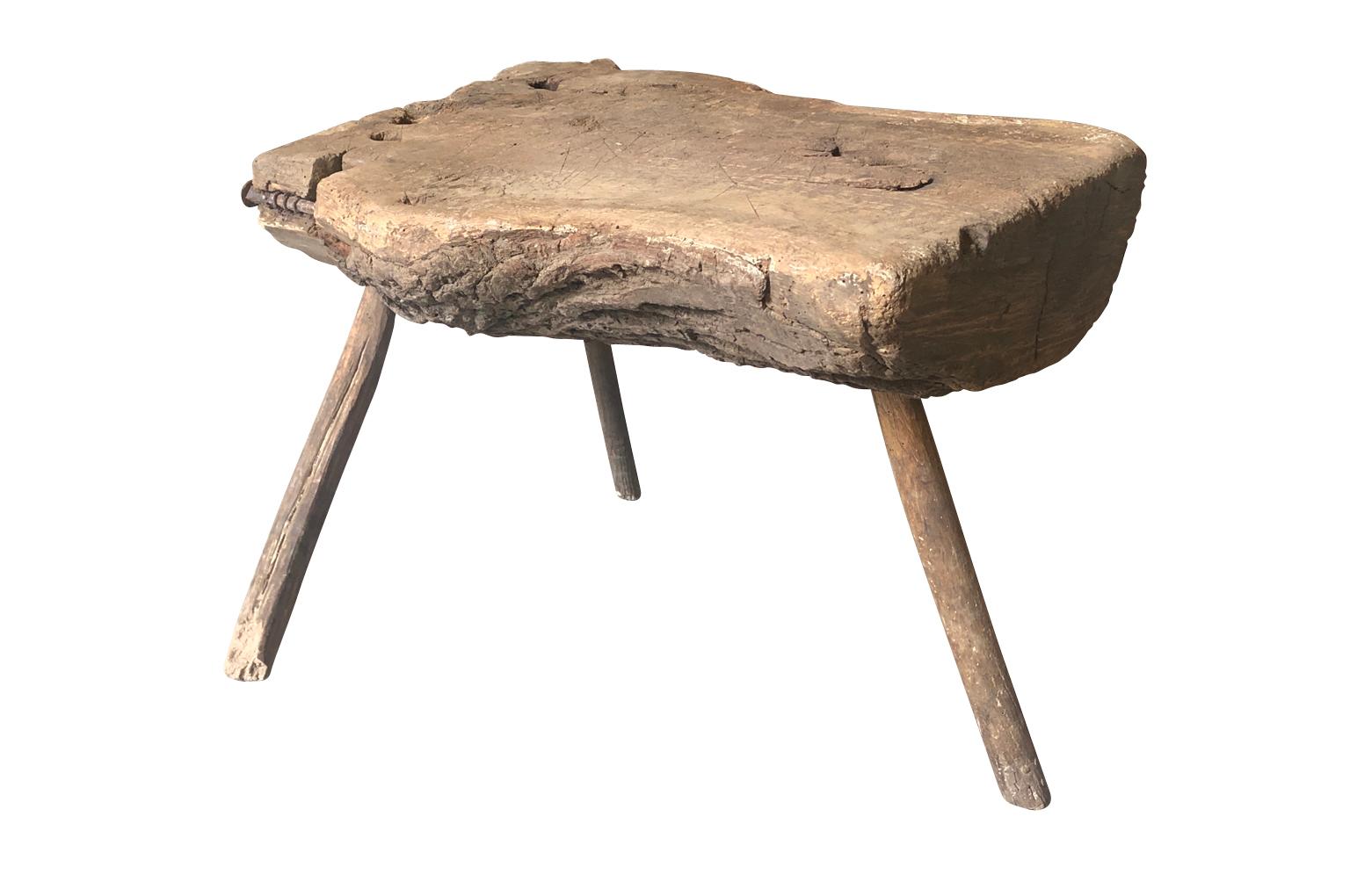 A delightful and primitive 18th century Arte Populaire, Folk Art stool, side table from the South of France. A terrific accent piece for any rustic surrounding.