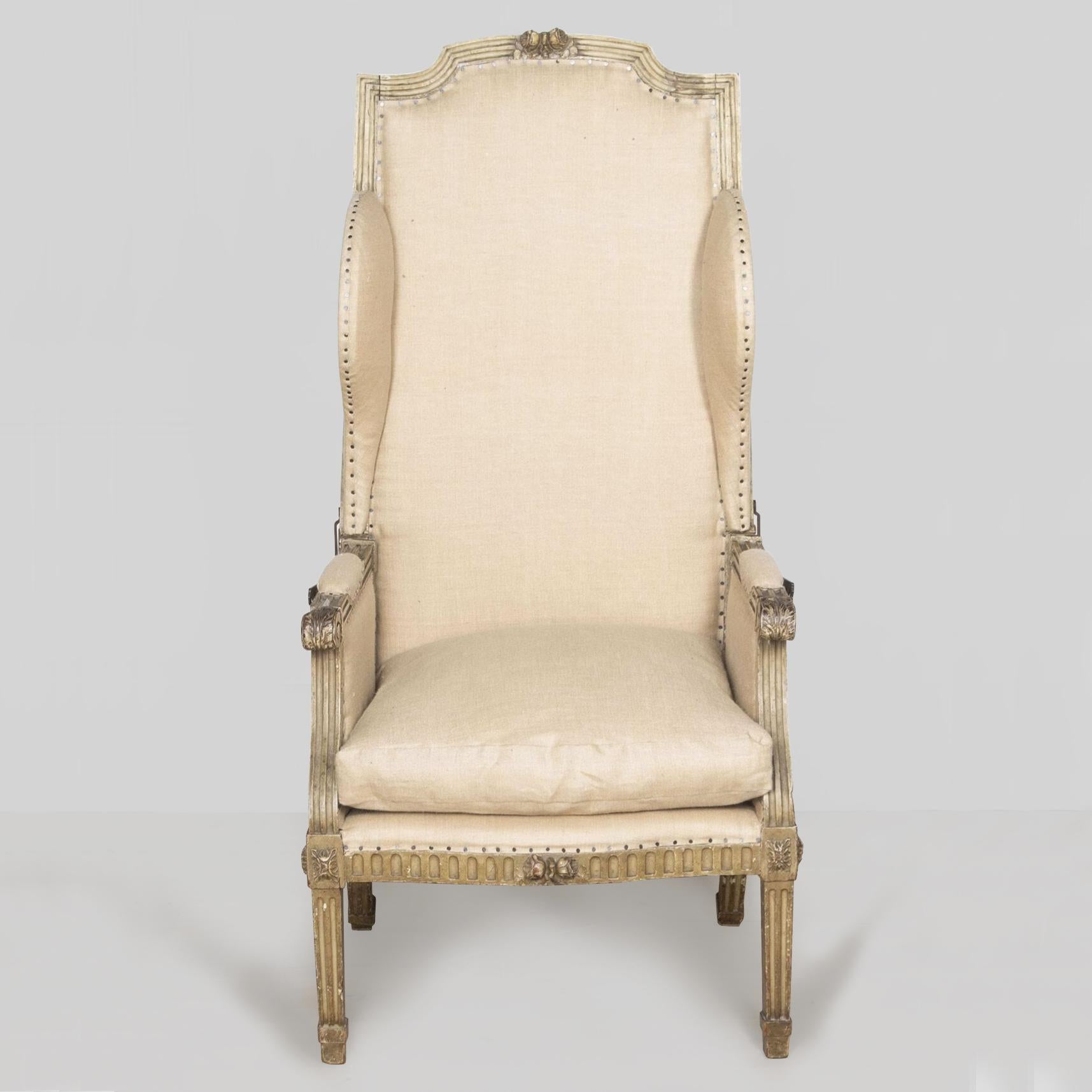 18th century highly unusual French Louis XVI painted reclining wing chair. 

The very high back with a carved and shaped top. 

The shallow wings on a channelled frame, the whole back reclining on steel ratchets.

The arms carved with acanthus