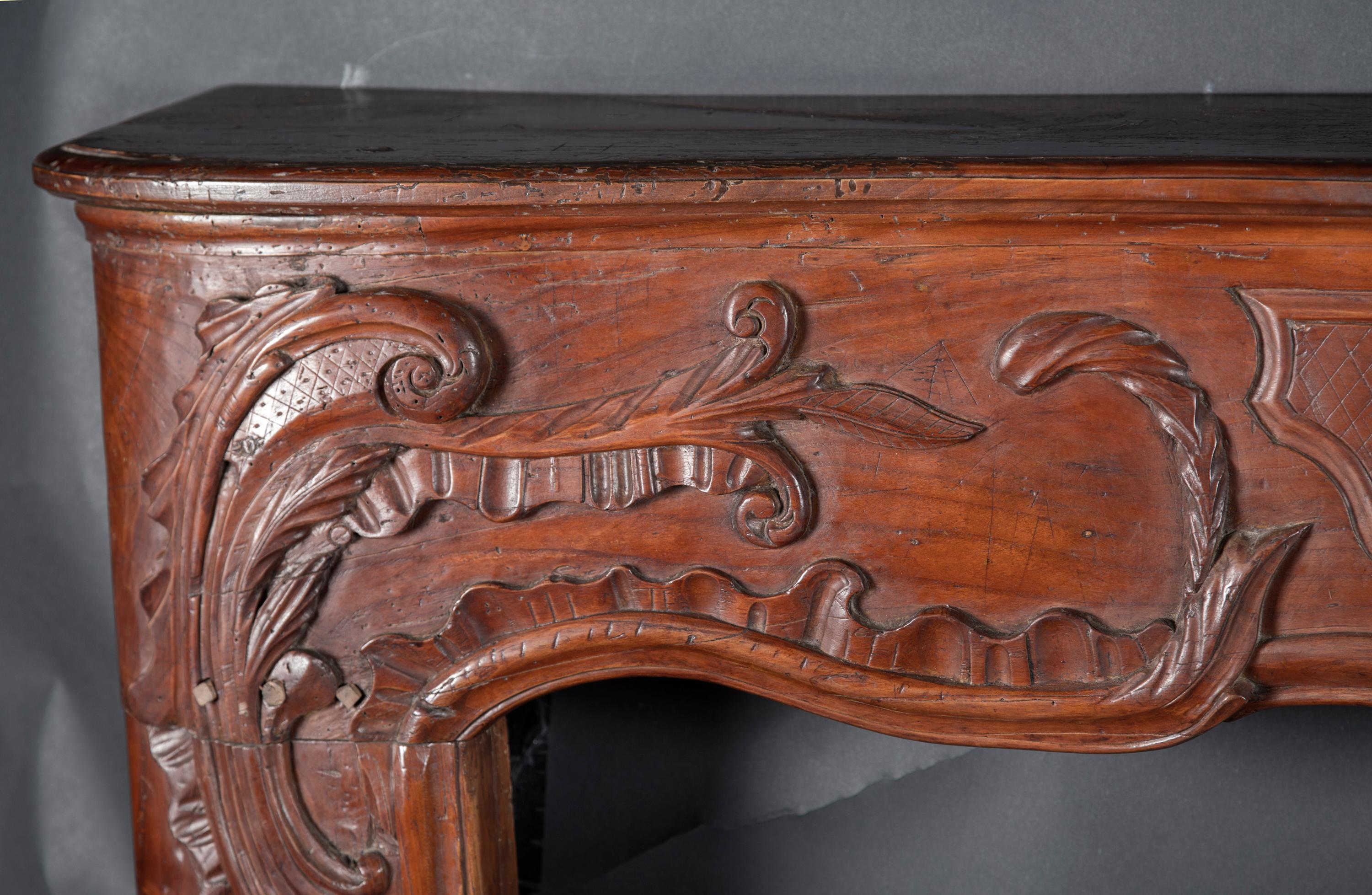French 18th Century Regence Carved Cherry Mantel In Good Condition For Sale In New Orleans, LA