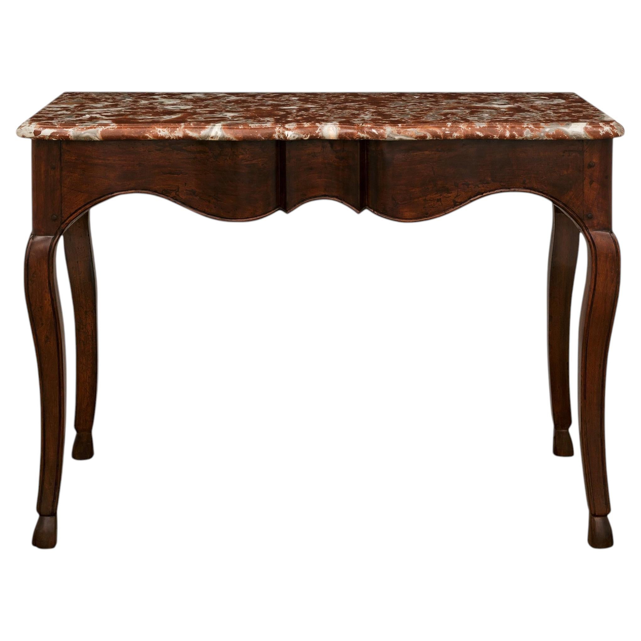 French 18th century Regence Period Walnut and Rouge Royale marble console For Sale