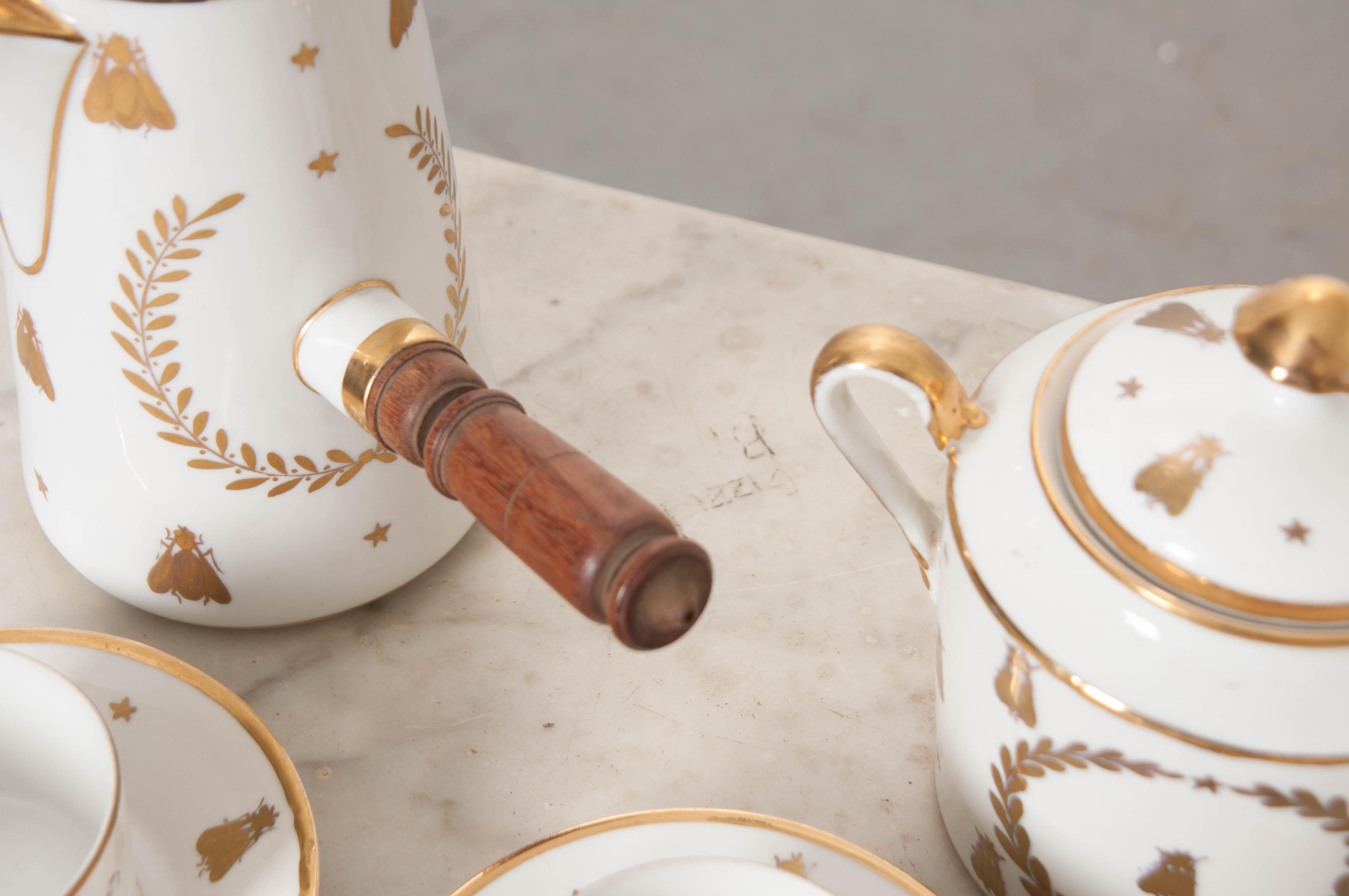 This fantastic Sèvres Porcelain hot chocolate set, circa 1755, is from France and features the gilded Napoleonic “Bee-and-Star” diapered motif centered by a laurel wreath; a stylized”Double L” underglaze blue mark centered by a “C”with “Ue Imple”