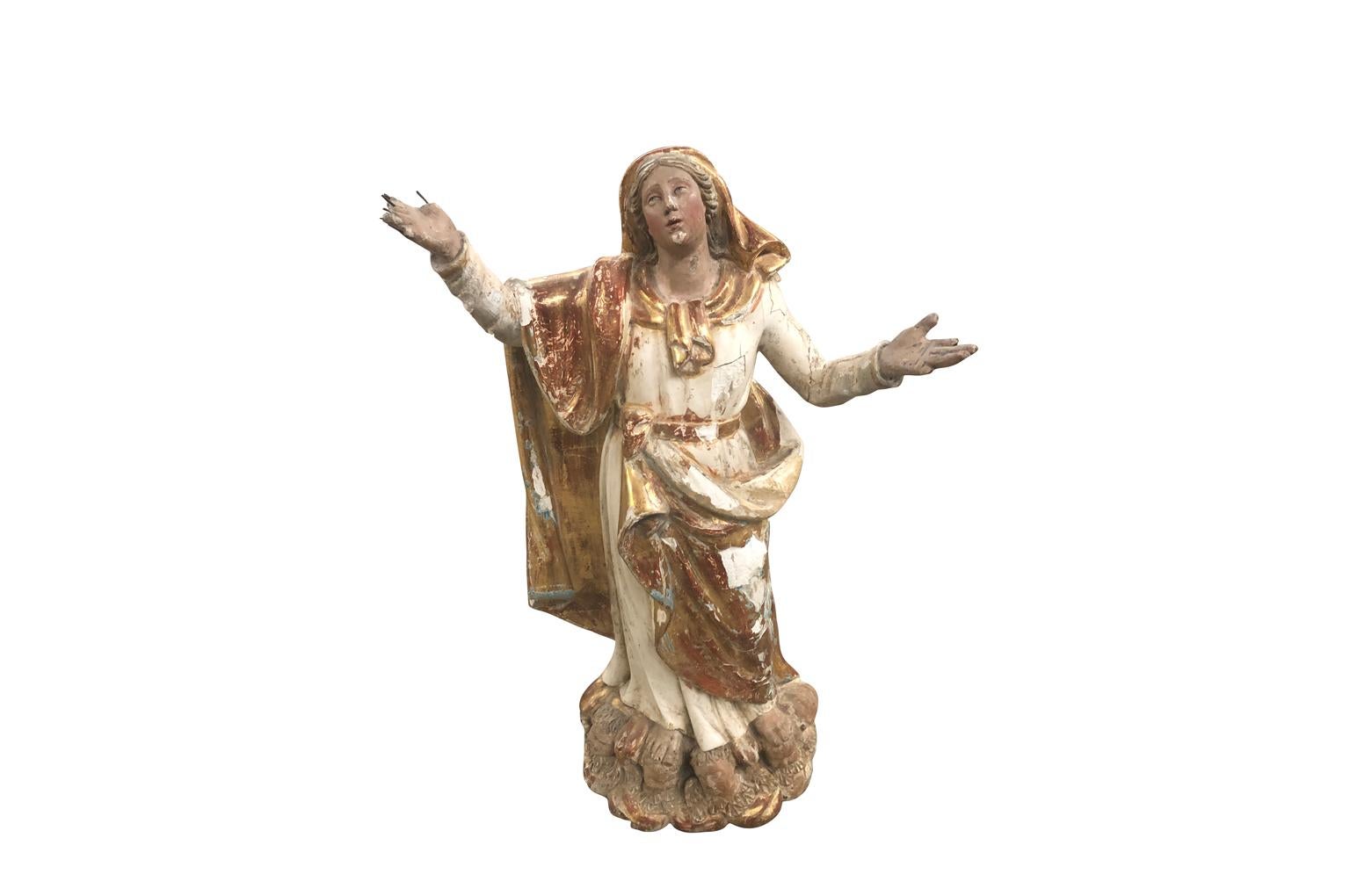 A very beautiful French 18th century Madonna statue as the assumption. Beautifully crafted from hand carved wood finished in polychrome and gilt. Exquisite features.