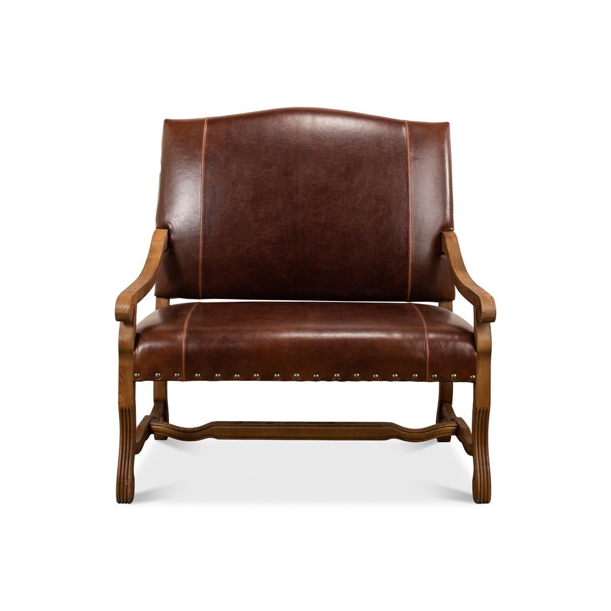 The warm tones of brown traditional leather paired with large brass nailhead decorations create a striking visual appeal. Transform your living space into a haven of sophistication. This settee isn't just furniture; it's a conversation starter, a