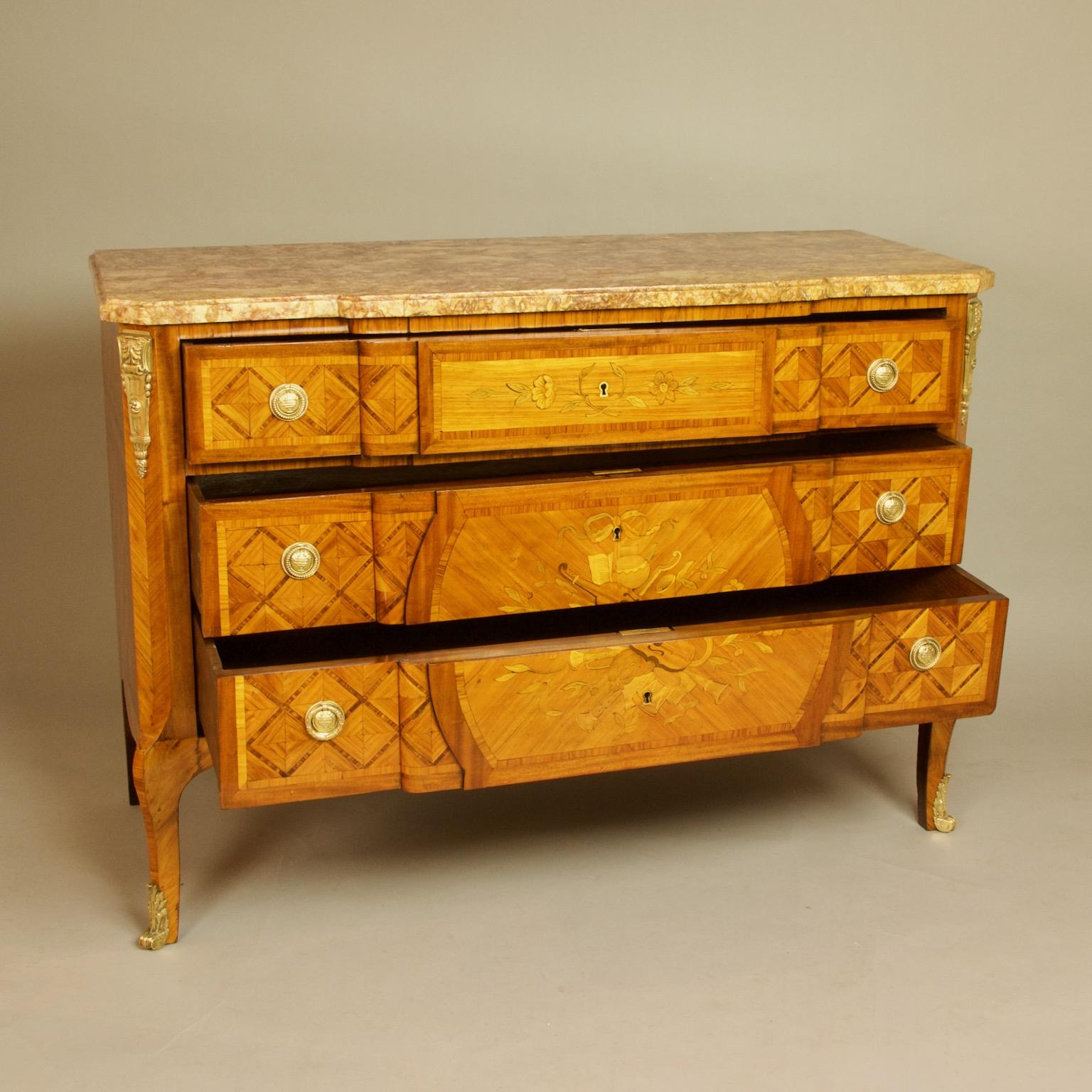French 18th century Transition/Louis XVI love symbols marquetry gilt bronze mounted commode

An excellent large Transition/Louis XVI love symbol marquetry double breakfront or 