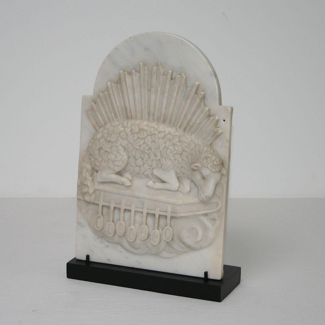 Beautiful and unique white marble tabernacle door representing the lamb of god.
France, circa 1750-1800.
Weathered.
     