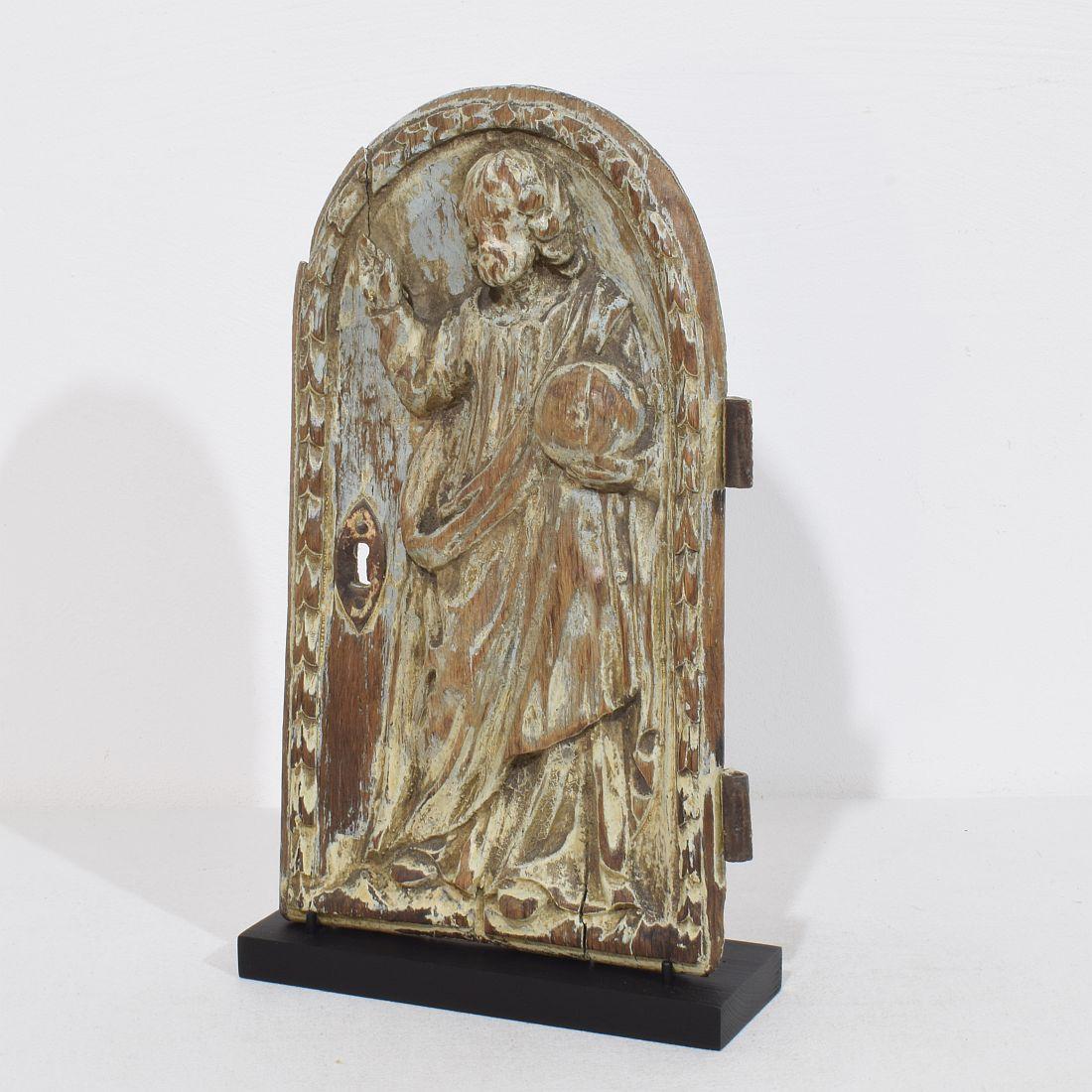 Wonderful hand-carved Oak tabernacle door depicting Christ/ Salvator mundi.
Beautiful weathered with traces of its original color.
France circa 1750
Measurements include the wooden base.
H:33,5cm  W:19,5cm D:6,5cm 