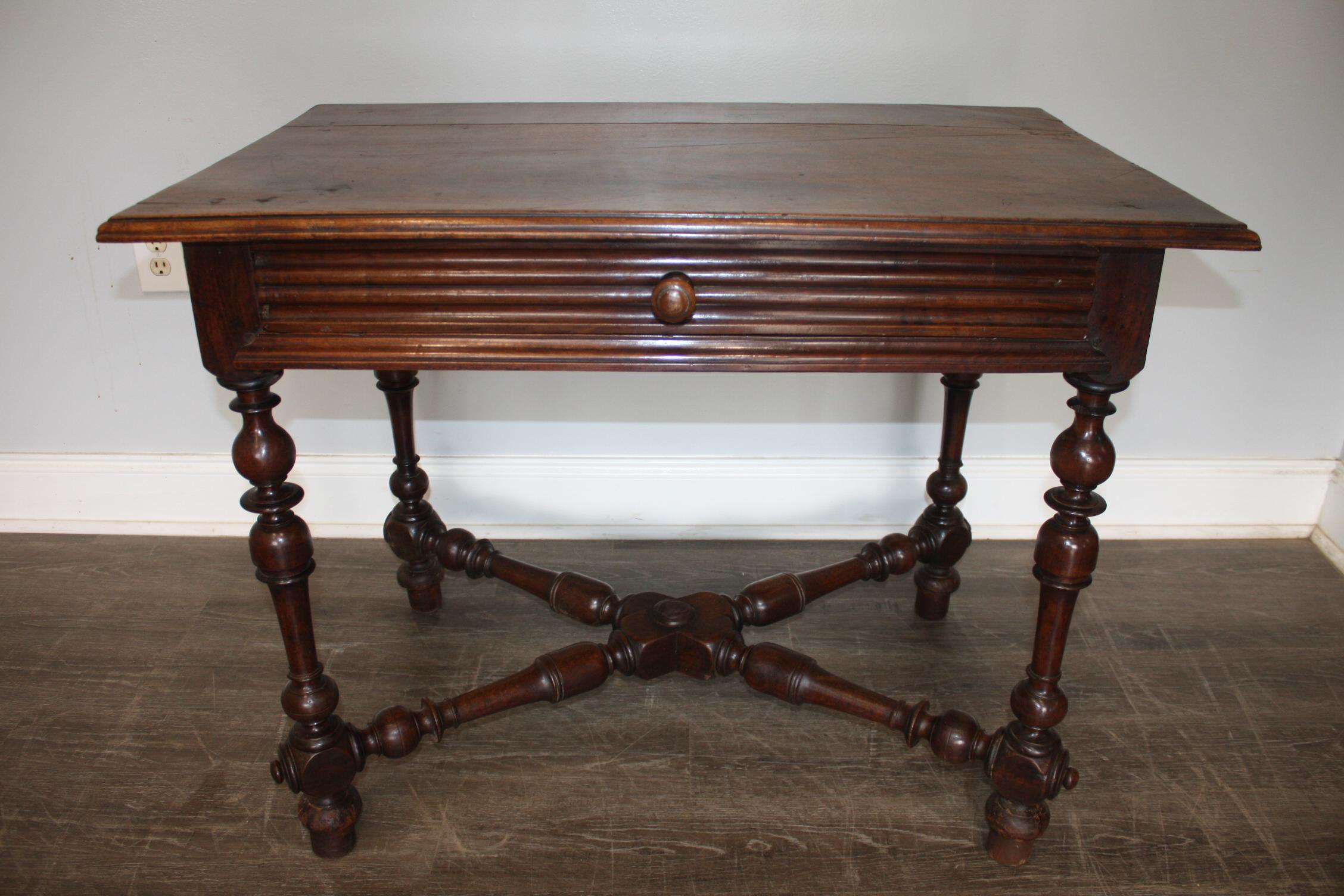 This writing table is made of walnut with wonderful patine.