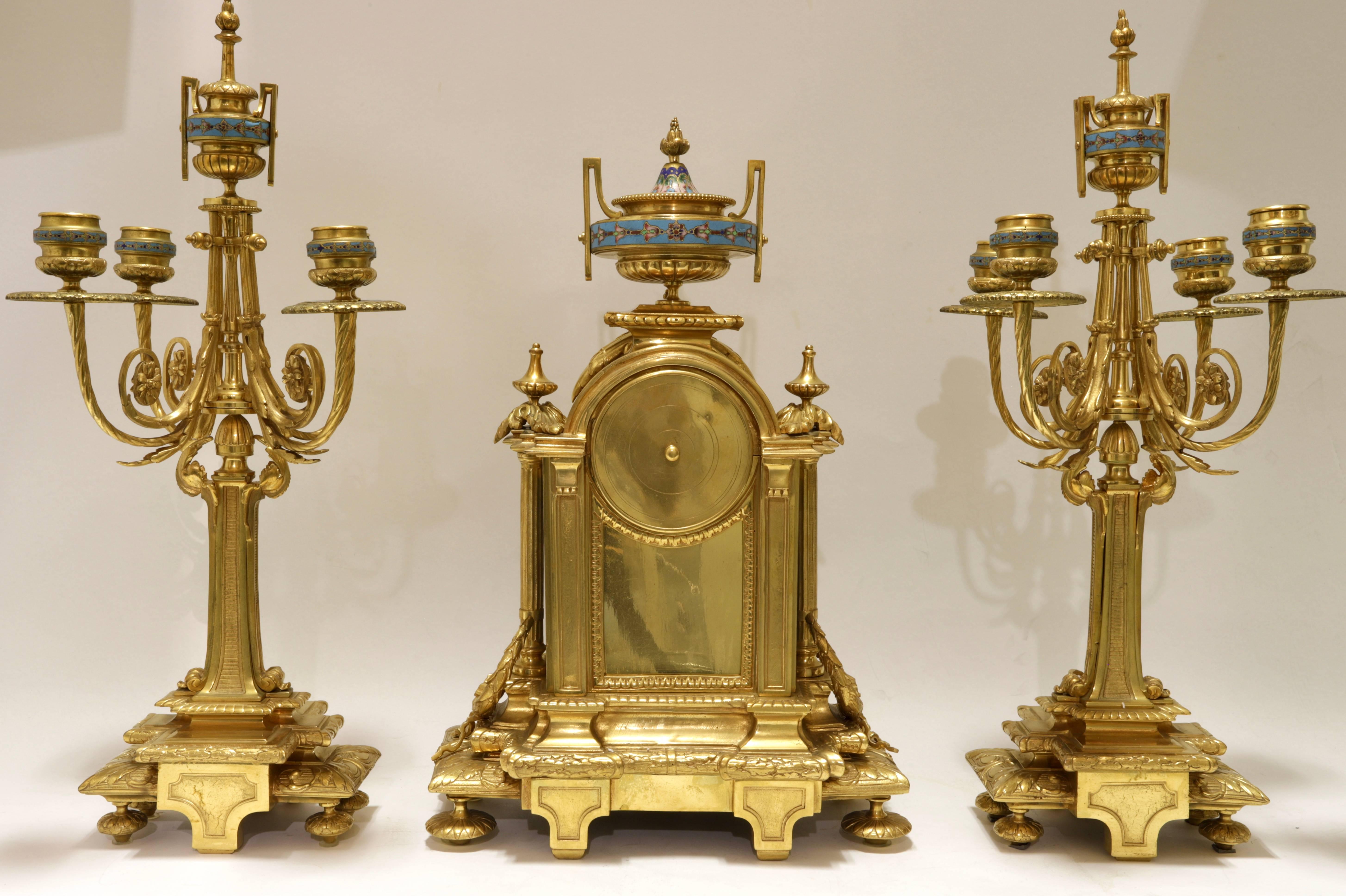 Very fine quality French 19th century Louis XVI style bronze and champlevé enamel clock set.
Consisting of a clock and a pair of matching candelabras.