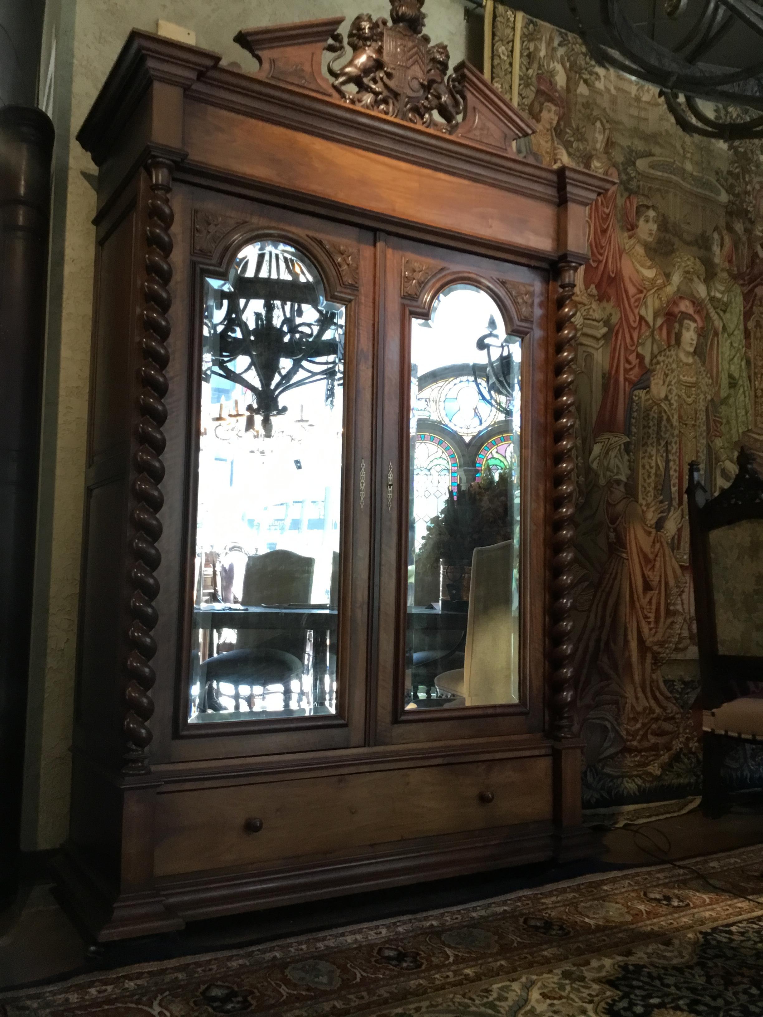 Handsome piece with well carved lion crest! Great storage and use as a
Closet for hanging clothes or it has notches inside to hold shelves if user
Prefers to add shelves for folded items. It has two drawers at the bottom of
The piece. It has