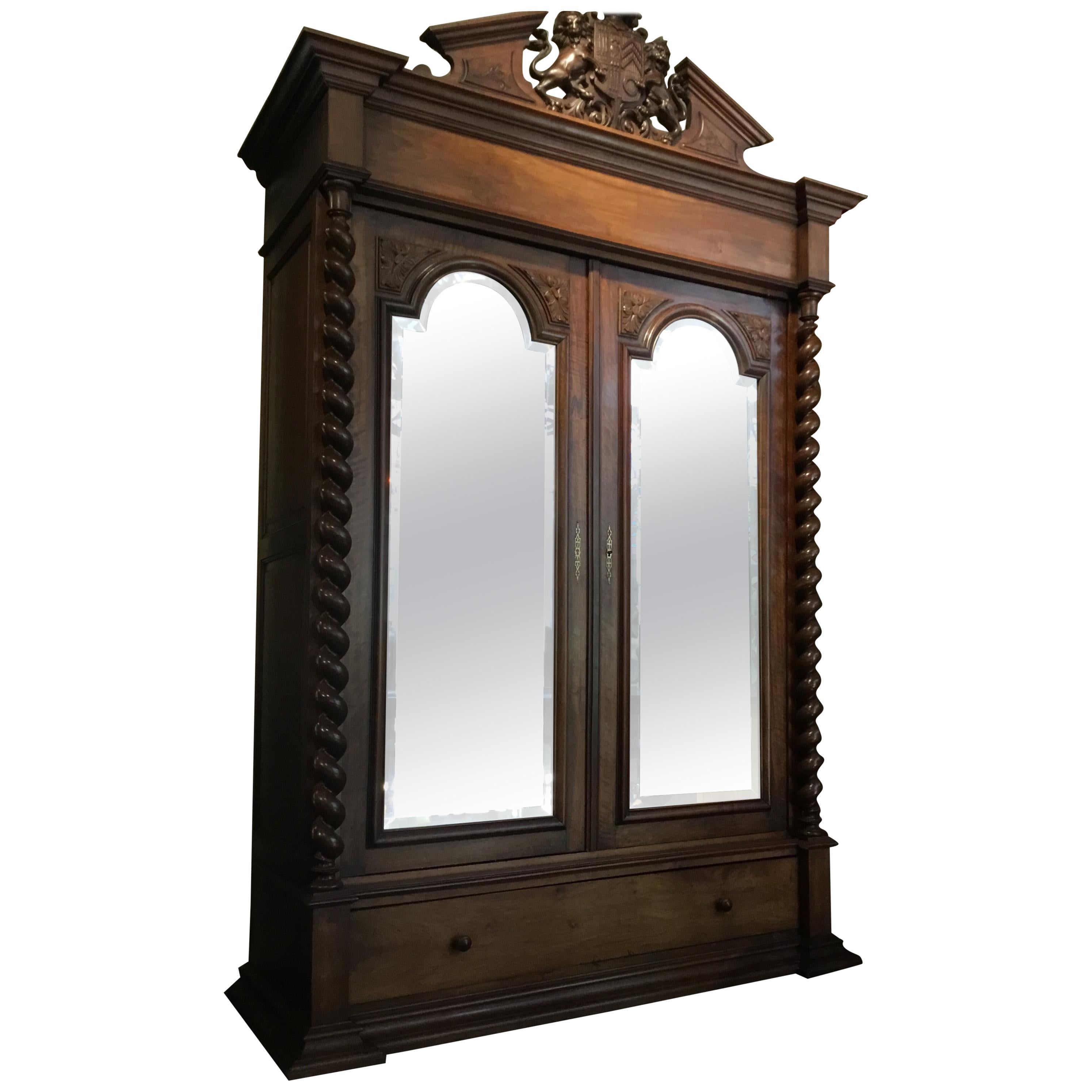 French 19th Century Armoire in Walnut with Carved Lion Crest