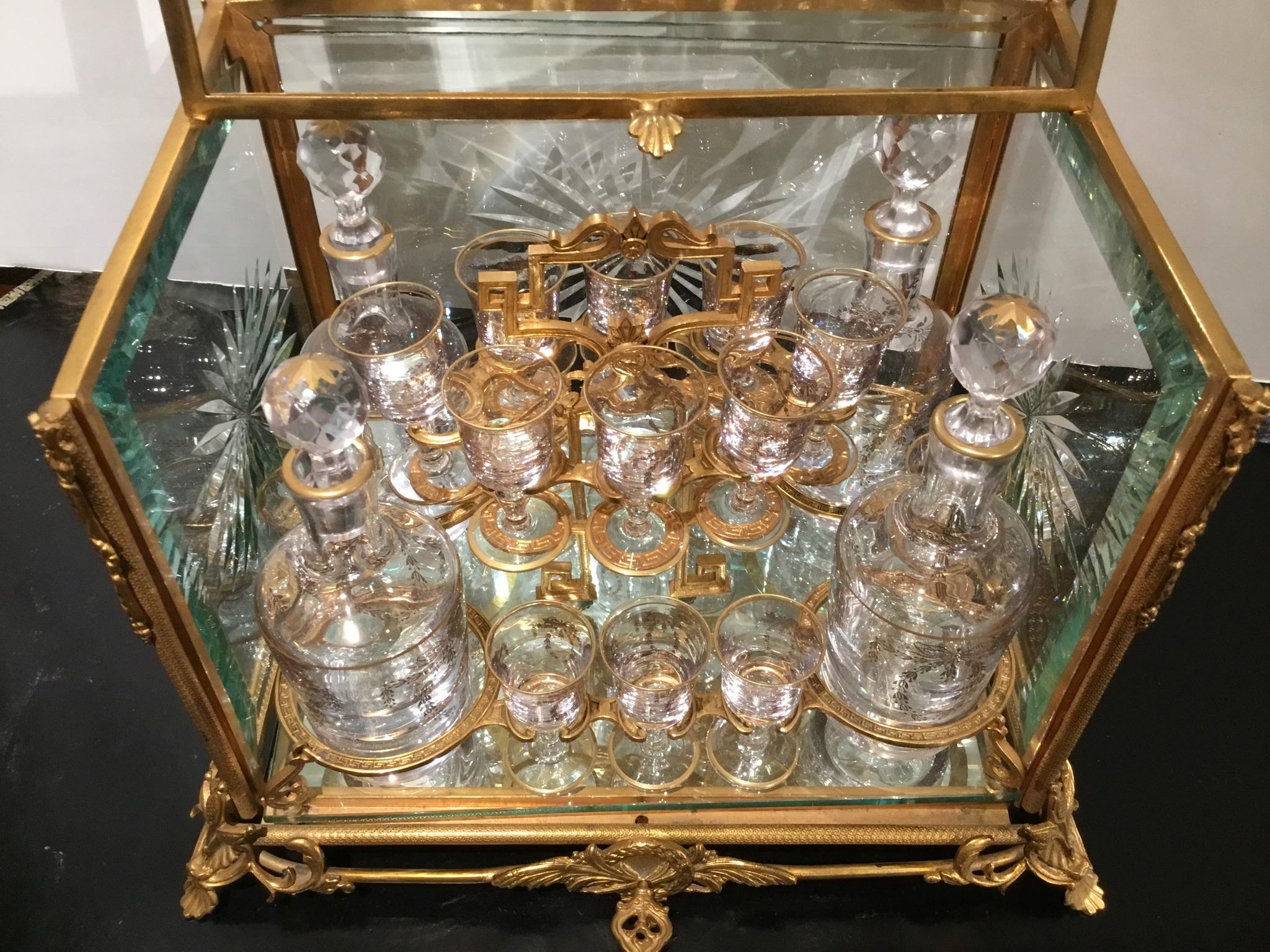 19th Century French Bronze and Glass Tantalus Set with Beveled and Cut Glass Panels