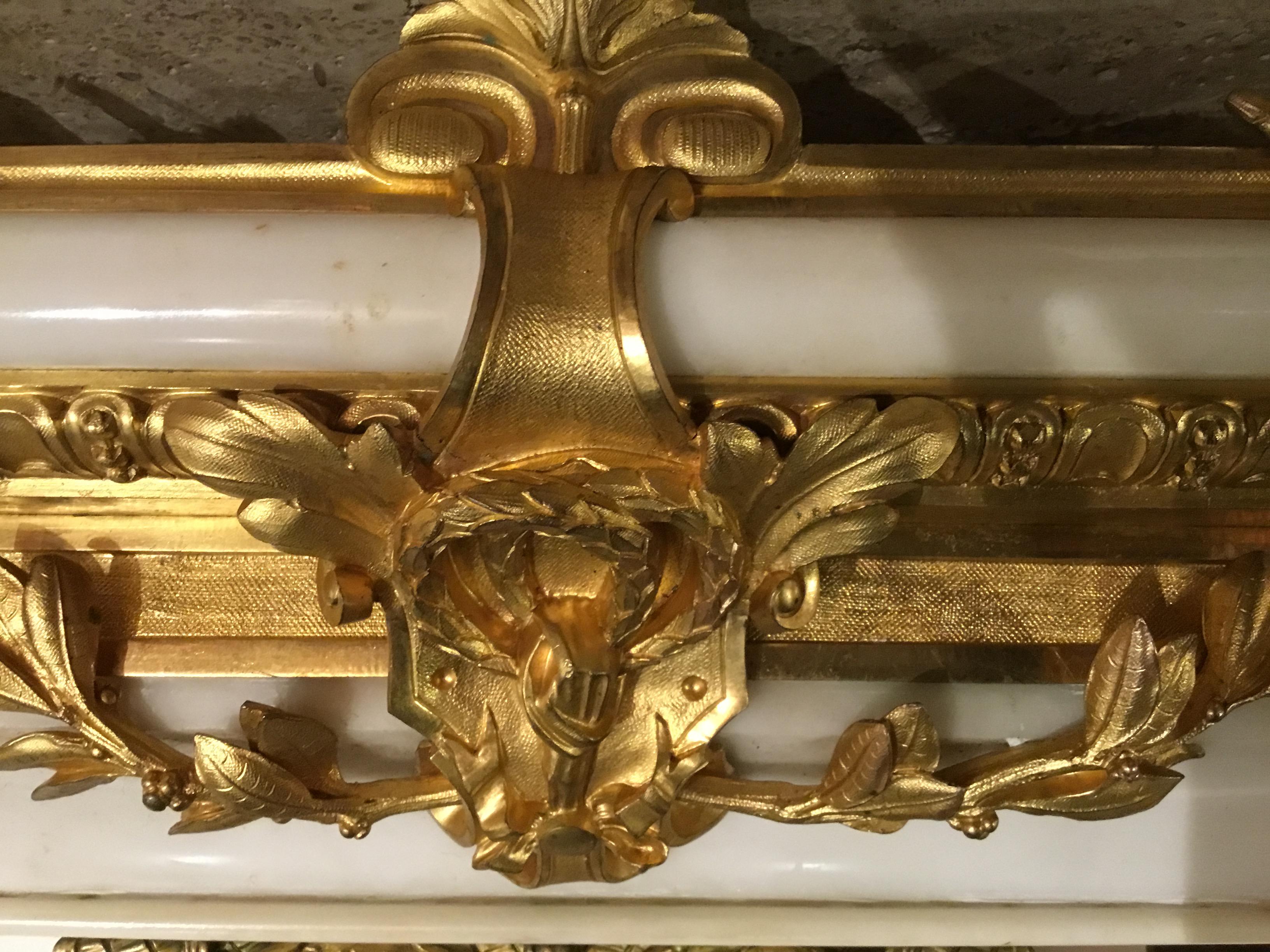 Very fine museum quality clock by J. B. Marchand. The casting and gilding are in great condition 
I is circa 1860 featuring a woman in classical dress reading to a youth, sitting at the top of the clock. Leaf and foliate design with a double