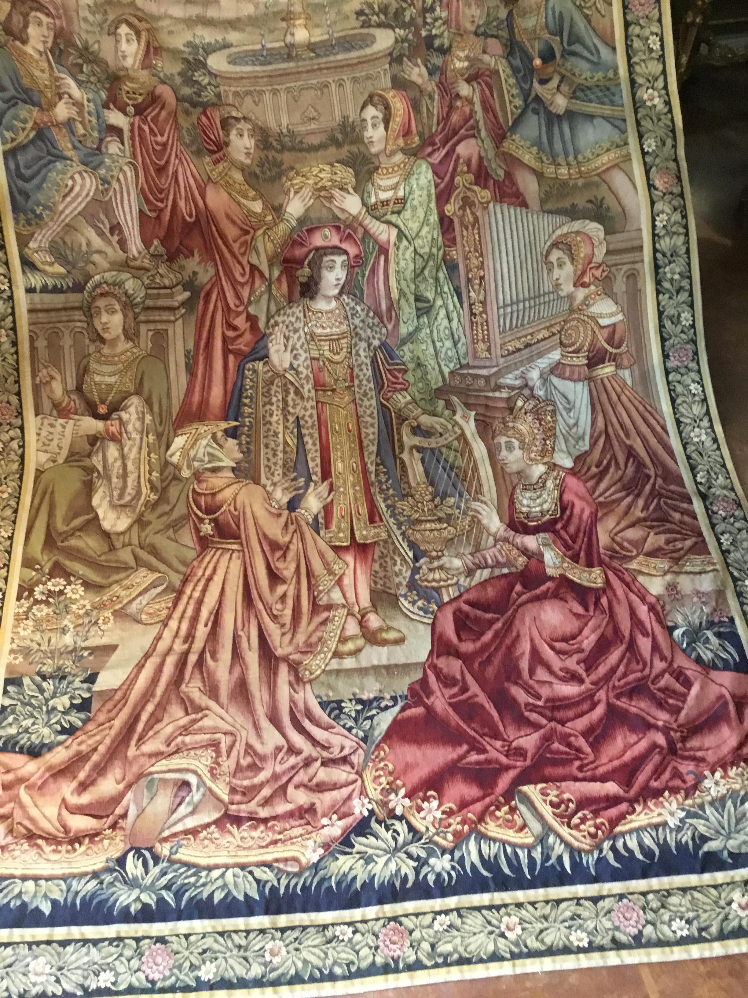 Rich warm colors of reds, blues and gold and banded with a foliate border. Very good antique condition ,Colors are vibrant and without fading. The fibers are all intact and show no wear. The historical 
Scene depicts a king at the center with two