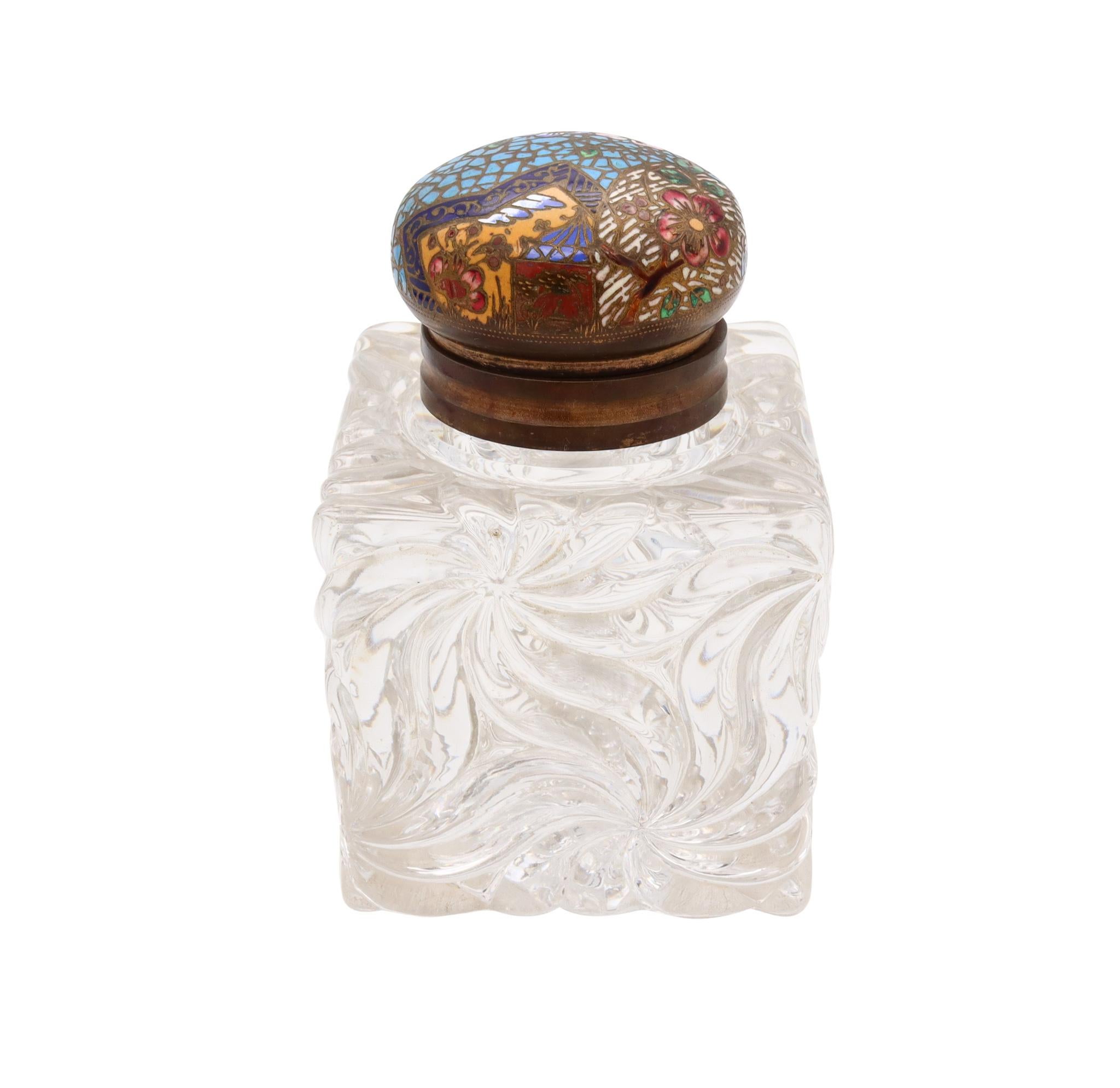 French champlevé inkwell.

An elusive antique inkwell, created in France, with chinoiserie patterns, back in the 1900's. Masterfully crafted in solid cut crystal and bronze ormolu. The hinged bronze lid on top is decorated with applications of hot