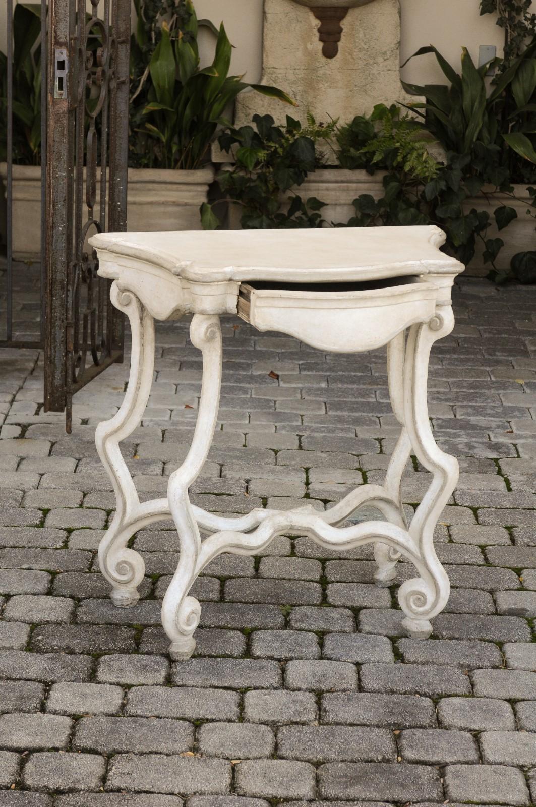 Carved French 1900 Rococo Style Painted Console Table with Scrolling Legs and Stretcher For Sale