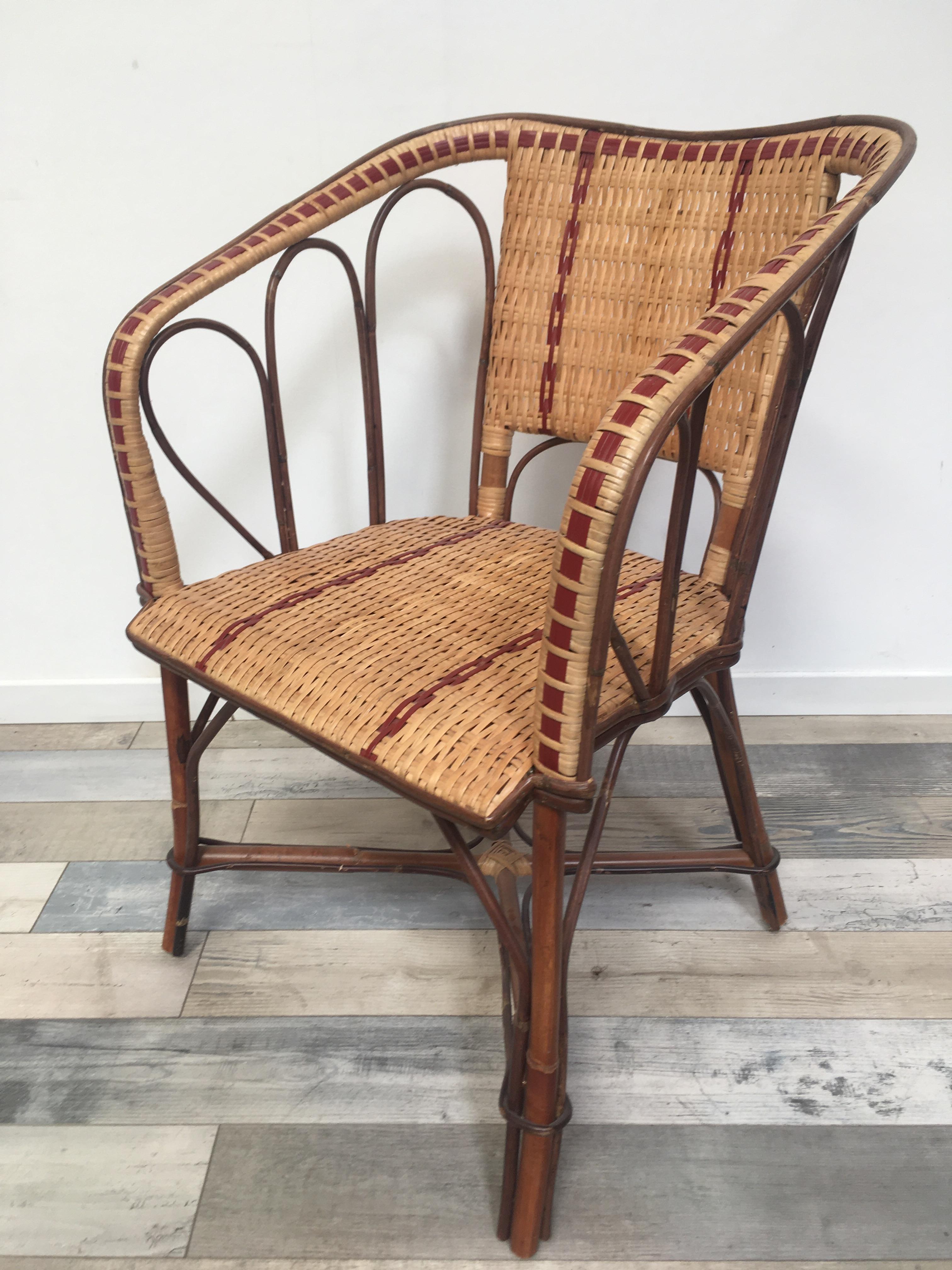 French Bistro Design rattan and wicker armchair composed of a rattan structure, braided wicker back and seat with a red outline, famous at the beginning of the 20th century in Paris, it will be perfect in your terrace, your garden, near the swimming