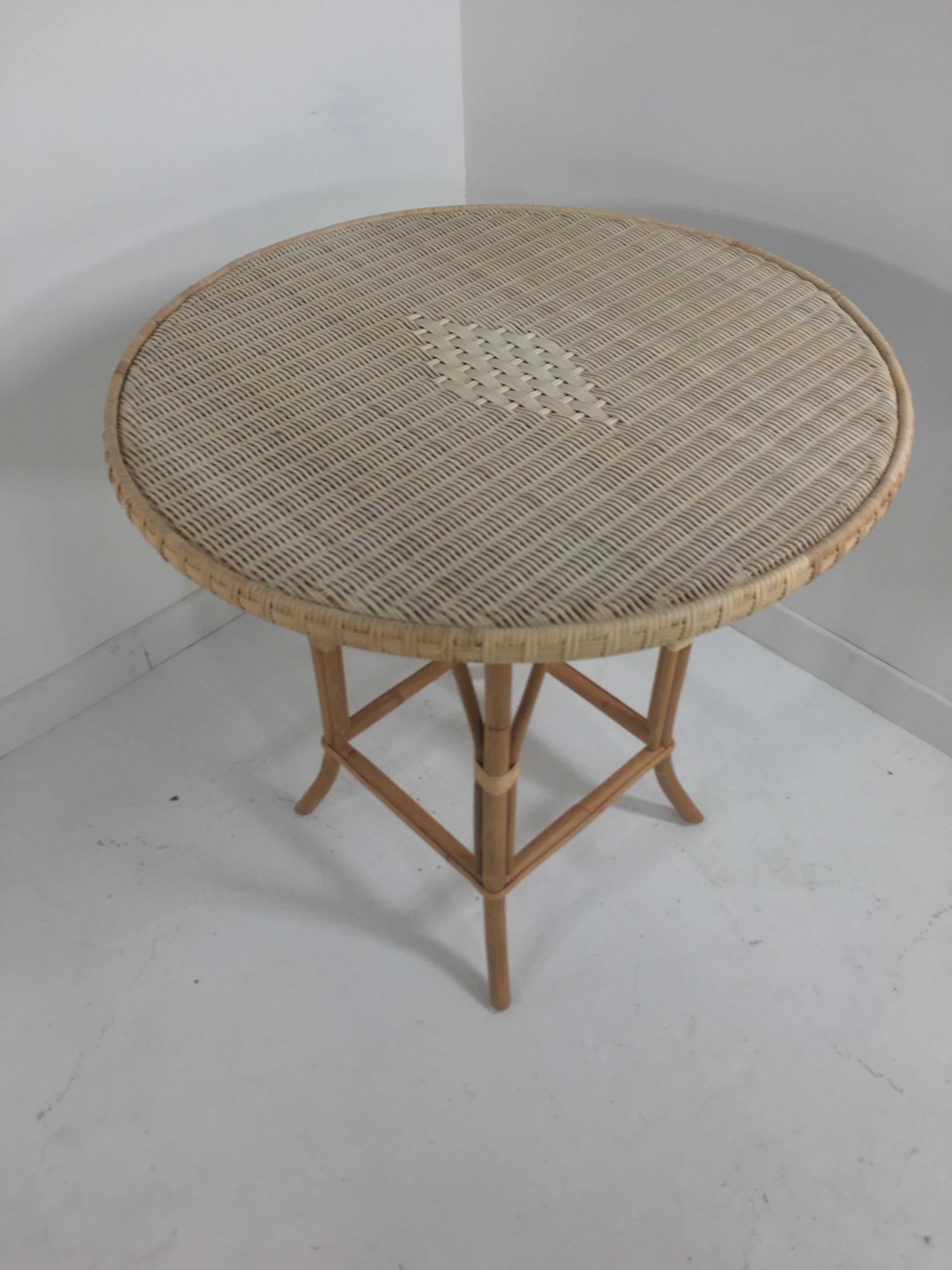 French 1900s Bistro Design rattan and braided wicker cane pedestal table composed of a rattan structure, braided rattan wicker cane round top, famous at the beginning of the 20th century in Paris and their bistro terrace, it will be perfect in your