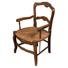 French 1900s Rustic Child's Chair with Carved Bouquet and Rush Seat