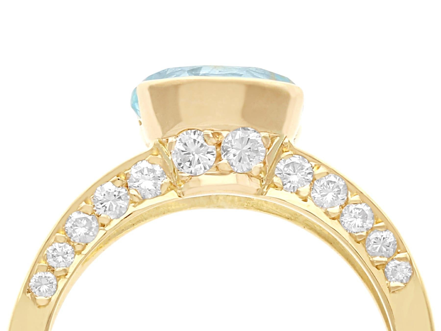 A fine and impressive vintage French 1.91 carat diamond and 1.63 ct aquamarine, 18 karat yellow gold dress ring; part of our diverse diamond jewelry and estate jewelry collections.

This stunning, fine and impressive aquamarine ring with diamonds