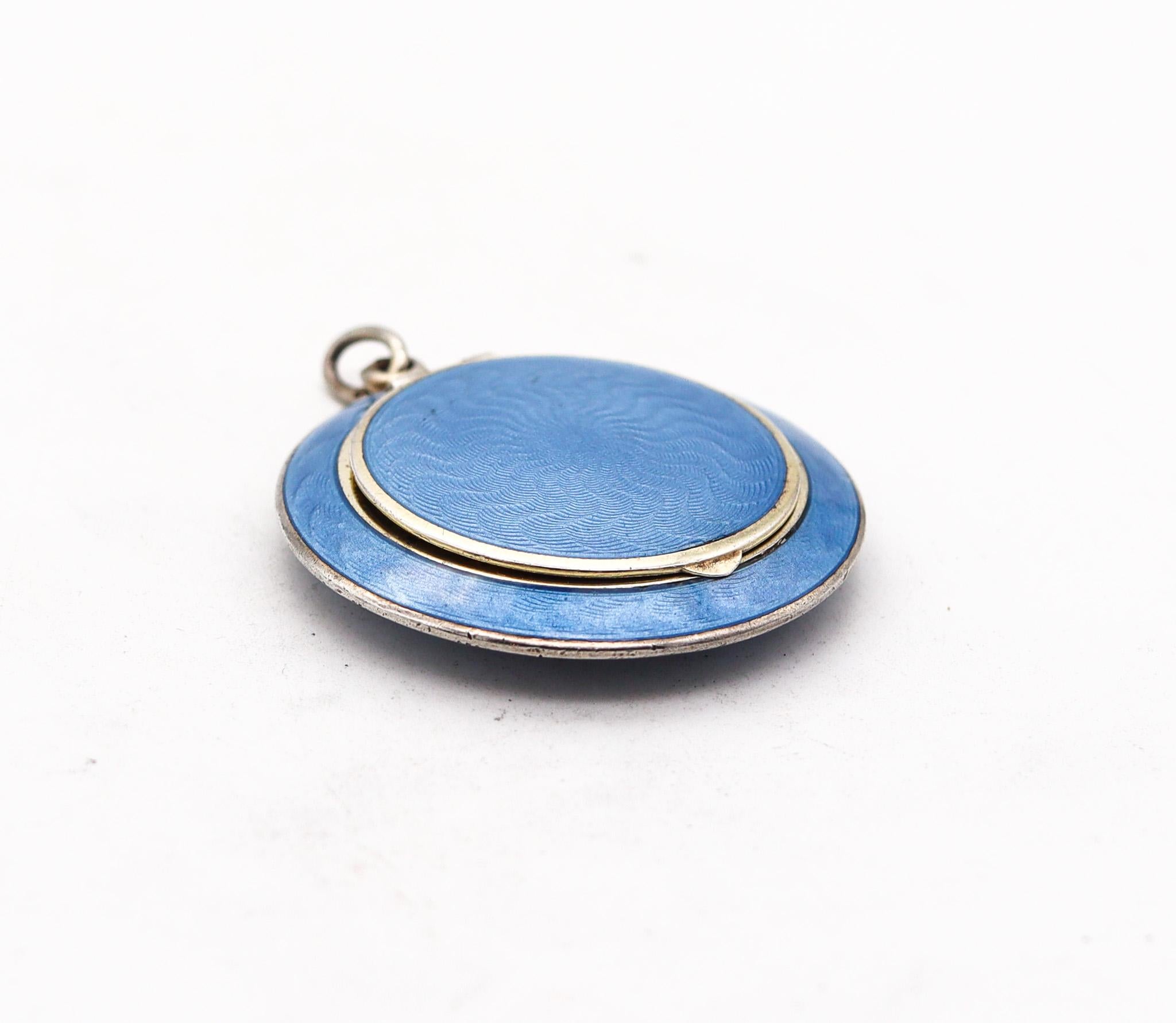 A French guilloche enameled pill box.

Very delicate French early 20th century enamel pendant, created during the late Edwardian and art nouveau period, circa 1910. This beautiful compact-pendant  was carefully crafted with impeccable details in
