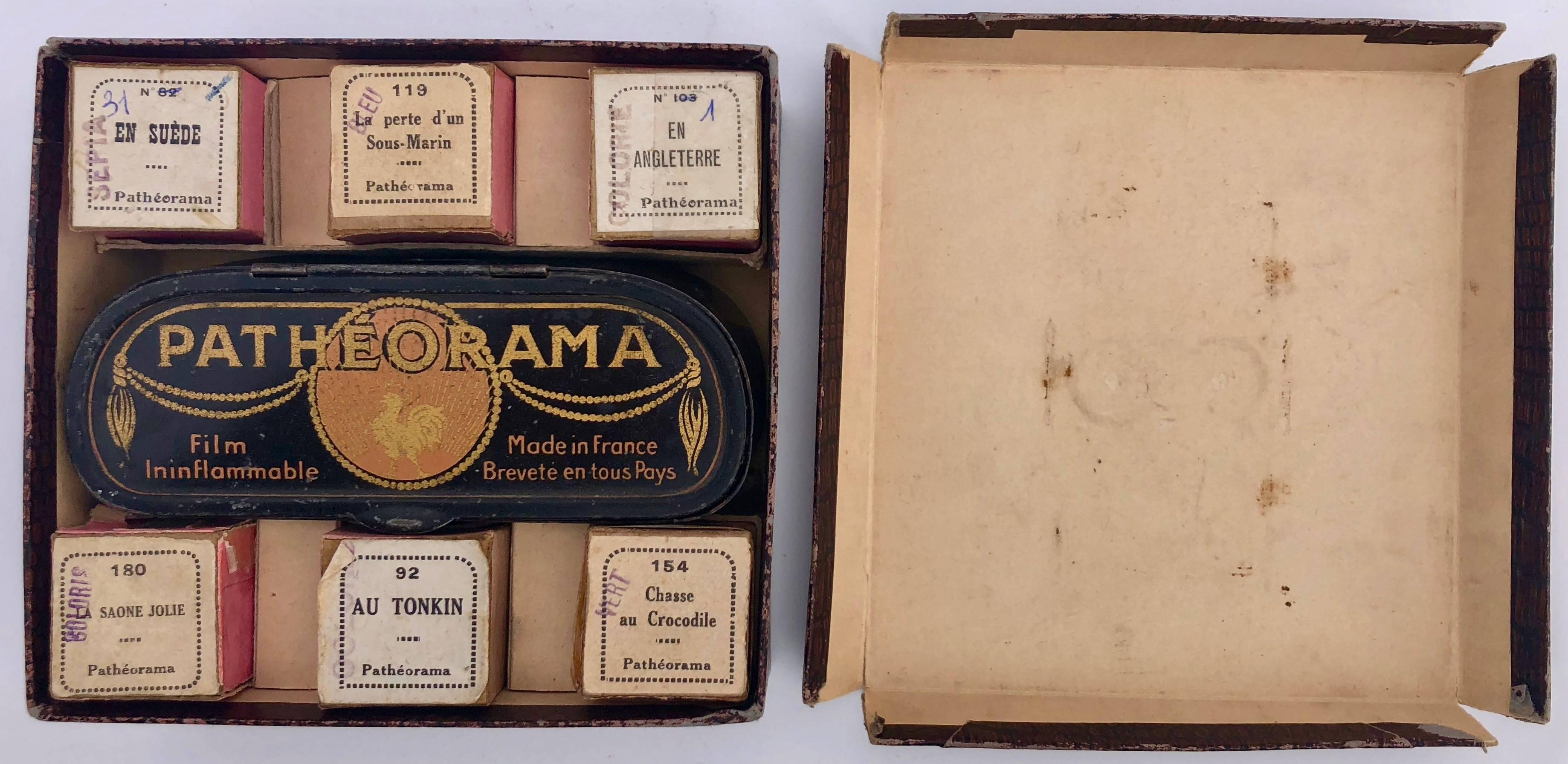 This Patheorama viewer was made by the French well-known cinema manufacturer PATHE in the 1920s. The viewer comes with 6 films and is in its original box (photo number 2) and has 3 original promotional brochures with it. 
There are two separate