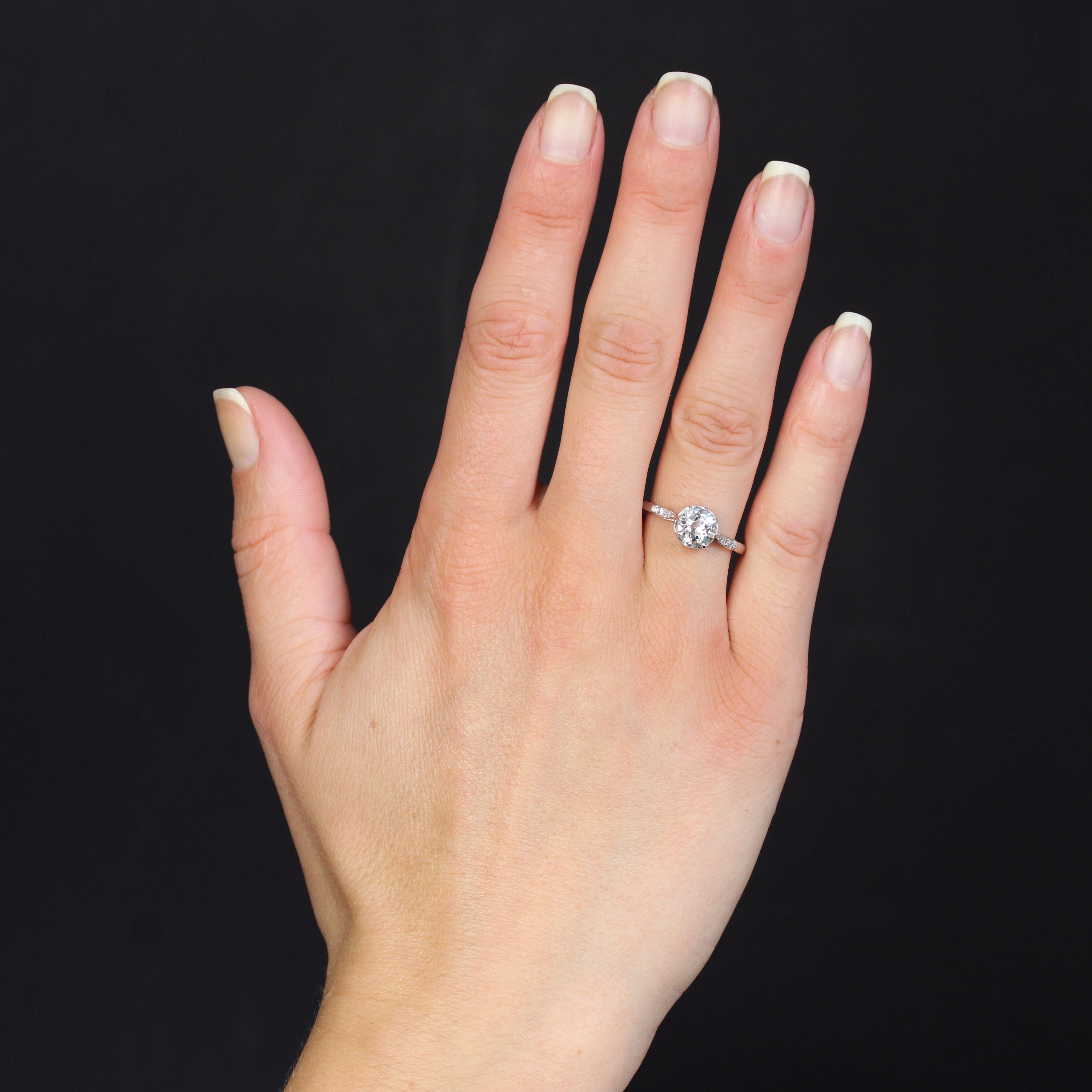 Platinum ring, dog's head hallmark.
A magnificent antique solitaire, this ring features a delicately openwork setting with heart-shaped motifs on the basket that supports a brilliant-cut antique-fashioned diamond held in place with claws. On either