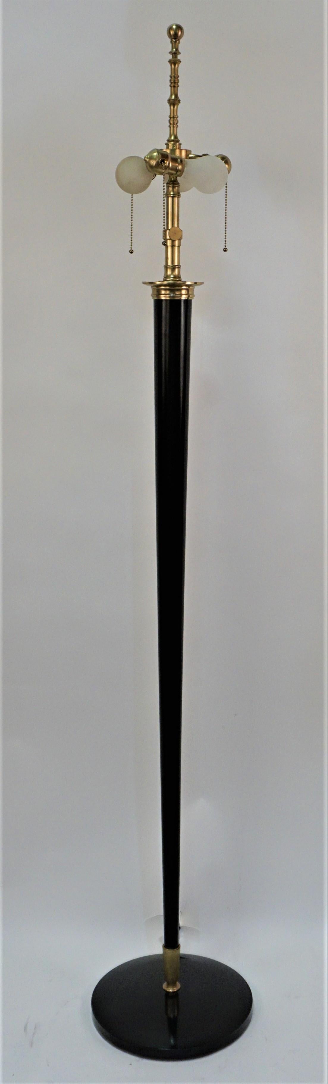 Simple but elegant bronze and lacquer on bronze 1920's floor lamp.
Three lights pull chain Max 150watt each.